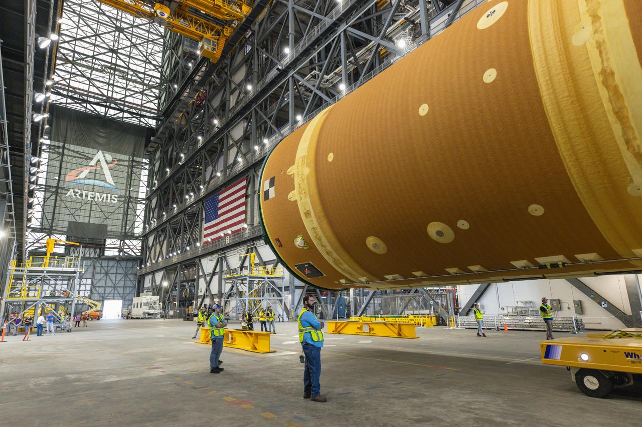 After completing its journey from NASA’s Michoud Assembly Facility in New Orleans aboard the Pegasus barge, teams with Exploration Ground Systems (EGS) transport the agency’s powerful SLS (Space Launch System) core stage into the transfer aisle inside Kennedy Space Center’s Vehicle Assembly Building in Florida on Wednesday, July 24, 2024. In the coming months, SLS will be prepared for integration atop the mobile launcher ahead of the Artemis II launch.