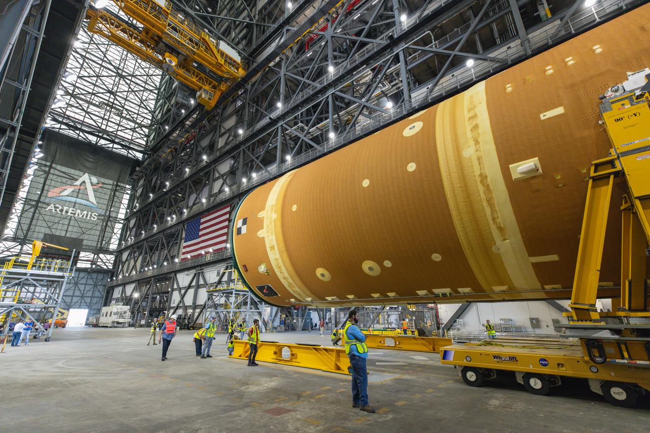 After completing its journey from NASA’s Michoud Assembly Facility in New Orleans aboard the Pegasus barge, teams with Exploration Ground Systems (EGS) transport the agency’s powerful SLS (Space Launch System) core stage into the transfer aisle inside Kennedy Space Center’s Vehicle Assembly Building in Florida on Wednesday, July 24, 2024. In the coming months, SLS will be prepared for integration atop the mobile launcher ahead of the Artemis II launch.
