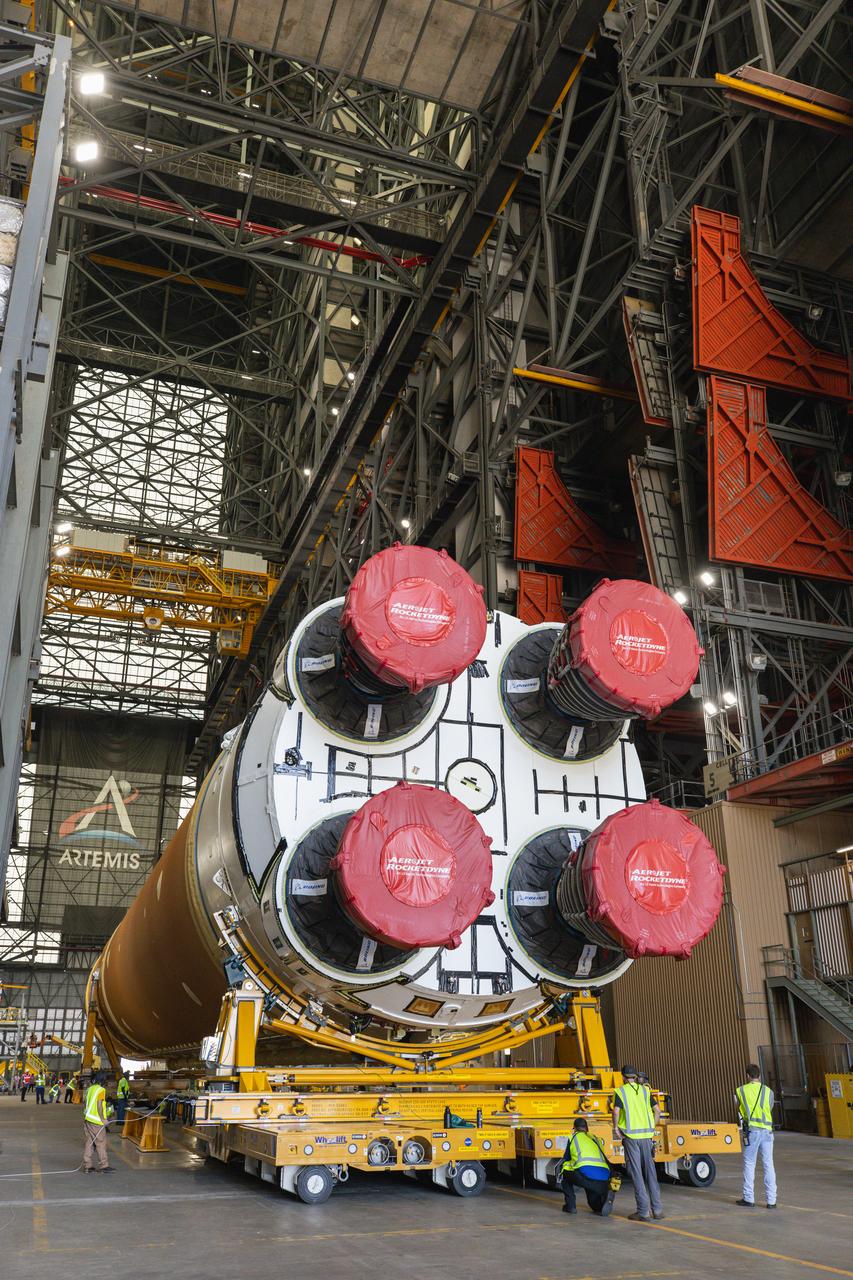 After completing its journey from NASA’s Michoud Assembly Facility in New Orleans aboard the Pegasus barge, teams with Exploration Ground Systems (EGS) transport the agency’s powerful SLS (Space Launch System) core stage into the transfer aisle inside Kennedy Space Center’s Vehicle Assembly Building in Florida on Wednesday, July 24, 2024. In the coming months, SLS will be prepared for integration atop the mobile launcher ahead of the Artemis II launch.