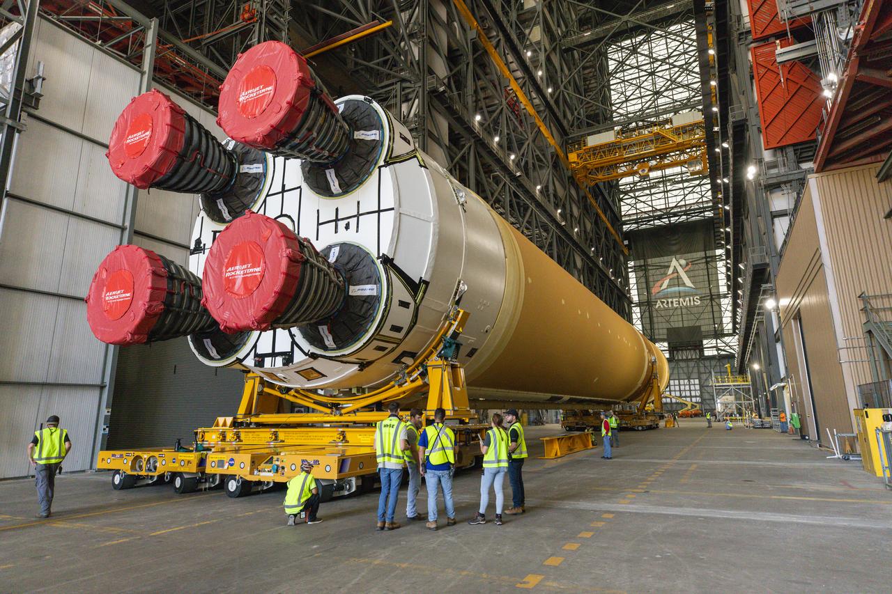 After completing its journey from NASA’s Michoud Assembly Facility in New Orleans aboard the Pegasus barge, teams with Exploration Ground Systems (EGS) transport the agency’s powerful SLS (Space Launch System) core stage into the transfer aisle inside Kennedy Space Center’s Vehicle Assembly Building in Florida on Wednesday, July 24, 2024. In the coming months, SLS will be prepared for integration atop the mobile launcher ahead of the Artemis II launch. 