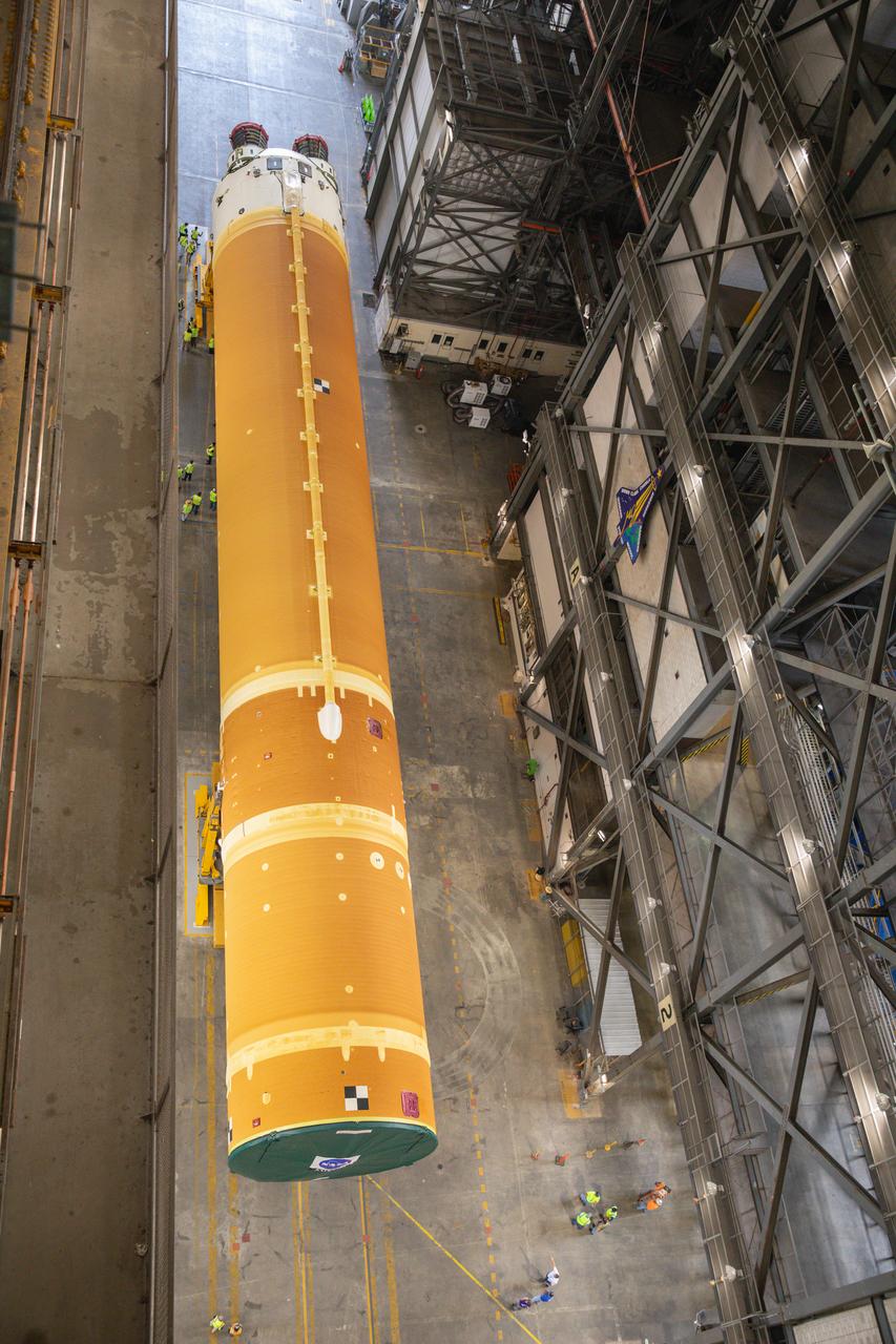 After completing its journey from NASA’s Michoud Assembly Facility in New Orleans aboard the Pegasus barge, teams with Exploration Ground Systems (EGS) transport the agency’s powerful SLS (Space Launch System) core stage into the transfer aisle inside Kennedy Space Center’s Vehicle Assembly Building in Florida on Wednesday, July 24, 2024. In the coming months, SLS will be prepared for integration atop the mobile launcher ahead of the Artemis II launch.