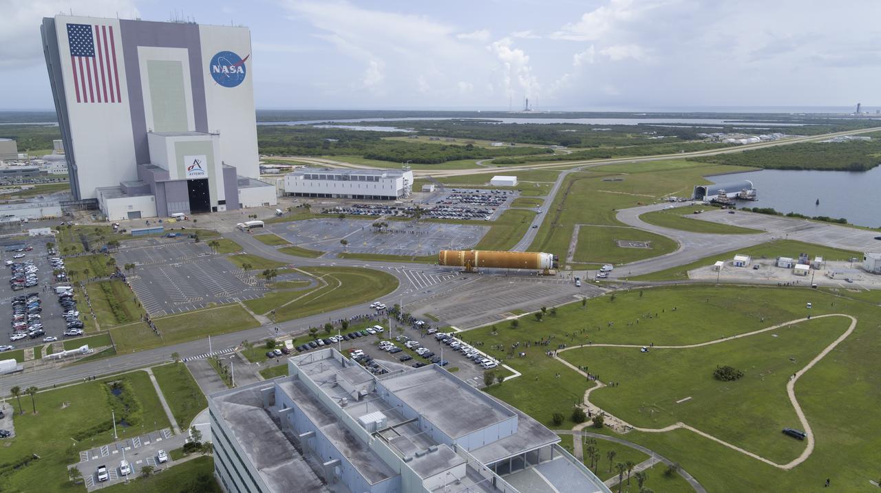 In this aerial view, teams with Exploration Ground Systems (EGS) transport the agency’s powerful SLS (Space Launch System) core stage to the Vehicle Assembly Building at NASA’s Kennedy Space Center in Florida on Wednesday, July 24, 2024, after it completed the journey from NASA’s Michoud Assembly Facility in New Orleans aboard the Pegasus barge. In the coming months, SLS will be prepared for integration atop the mobile launcher ahead of the Artemis II launch. 