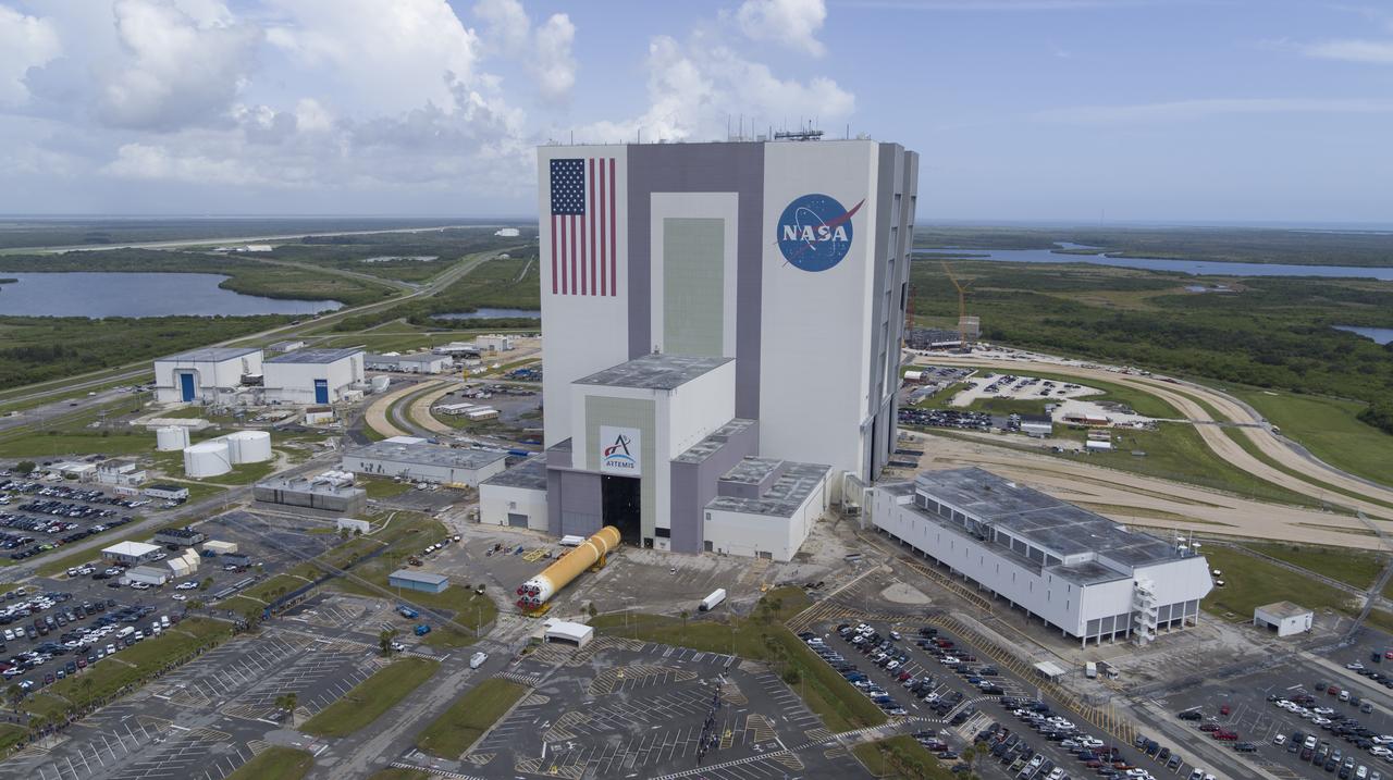 In this aerial view, teams with Exploration Ground Systems (EGS) transport the agency’s powerful SLS (Space Launch System) core stage to the Vehicle Assembly Building at NASA’s Kennedy Space Center in Florida on Wednesday, July 24, 2024, after it completed the journey from NASA’s Michoud Assembly Facility in New Orleans aboard the Pegasus barge. In the coming months, SLS will be prepared for integration atop the mobile launcher ahead of the Artemis II launch. 