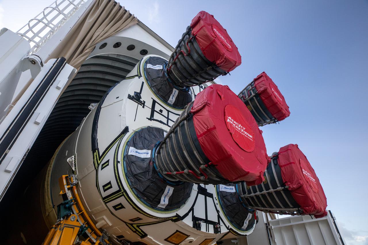 NASA’s massive 212-foot long SLS (Space Launch System) core stage is offloaded from the agency’s Pegasus Barge on Wednesday, July 24, 2024, after arriving at NASA’s Kennedy Space Center in Florida. Teams with Exploration Ground Systems (EGS) will transfer the rocket stage to the spaceport’s Vehicle Assembly Building to prepare it for integration atop the mobile launcher ahead of the Artemis II launch.