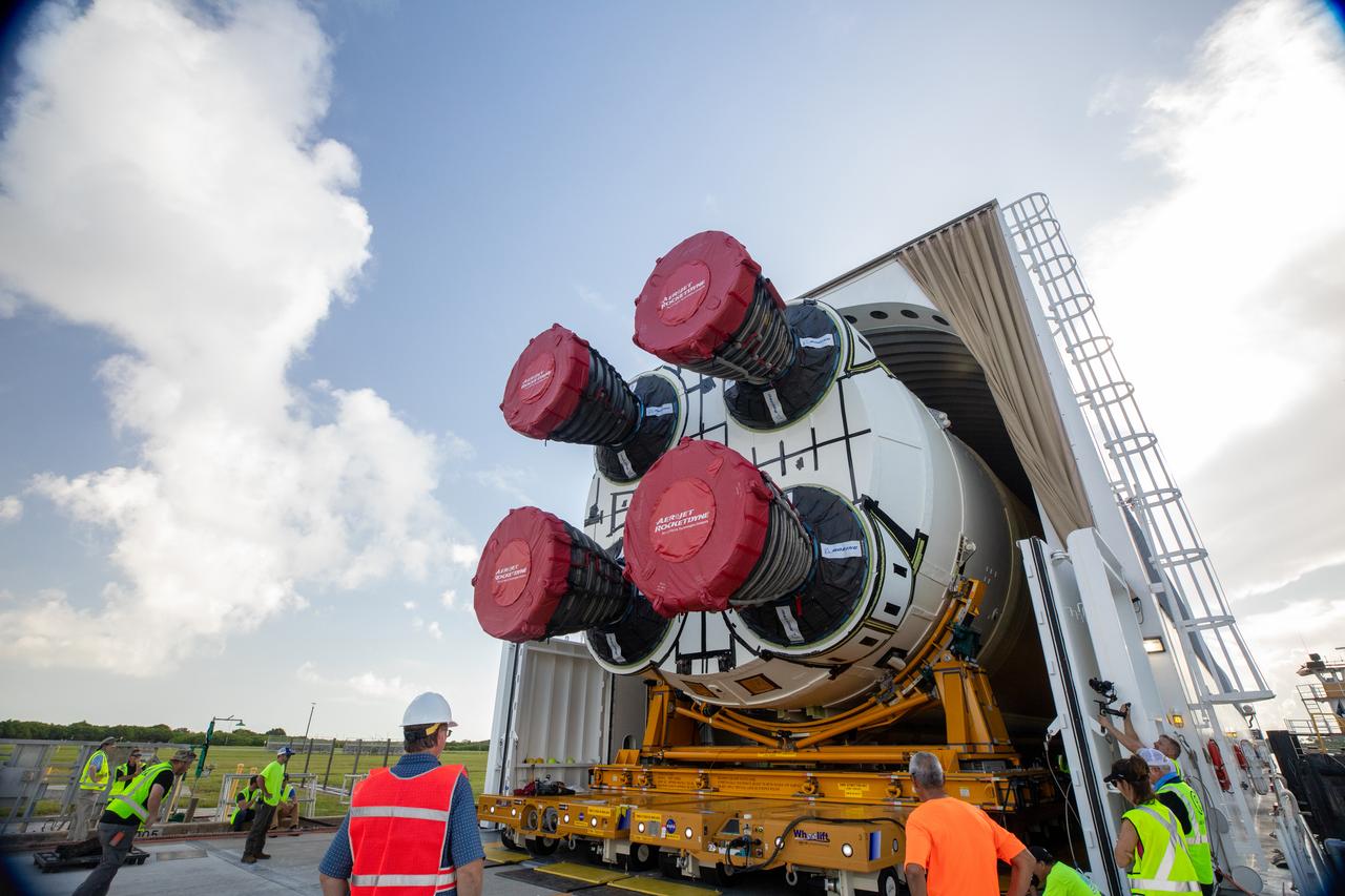 NASA’s massive 212-foot long SLS (Space Launch System) core stage is offloaded from the agency’s Pegasus Barge on Wednesday, July 24, 2024, after arriving at NASA’s Kennedy Space Center in Florida. Teams with Exploration Ground Systems (EGS) will transfer the rocket stage to the spaceport’s Vehicle Assembly Building to prepare it for integration atop the mobile launcher ahead of the Artemis II launch.