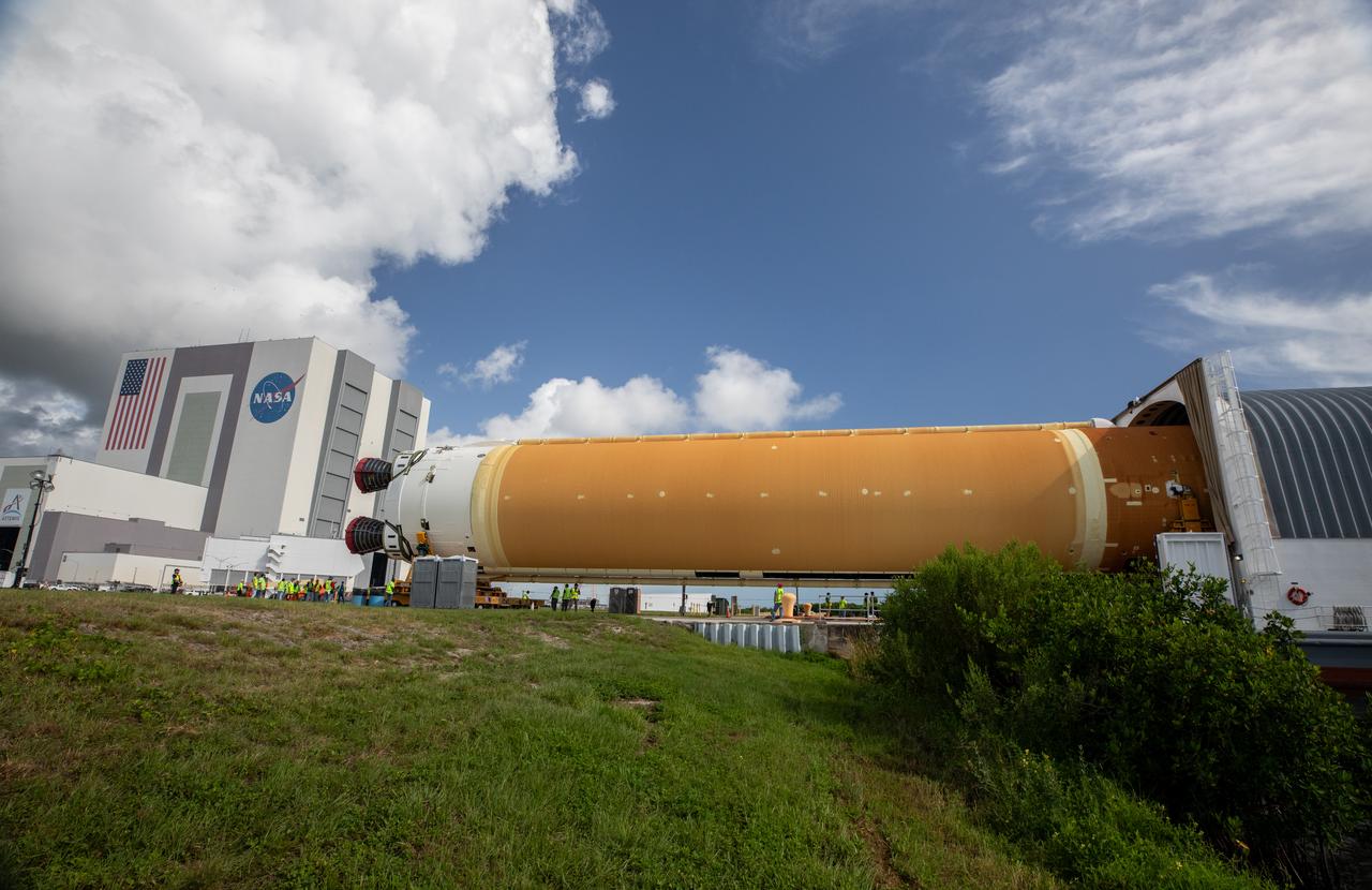 NASA’s massive 212-foot long SLS (Space Launch System) core stage is offloaded from the agency’s Pegasus Barge on Wednesday, July 24, 2024, after arriving at NASA’s Kennedy Space Center in Florida. Teams with Exploration Ground Systems (EGS) will transfer the rocket stage to the spaceport’s Vehicle Assembly Building to prepare it for integration atop the mobile launcher ahead of the Artemis II launch.