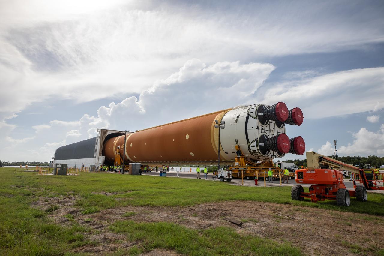 NASA’s massive 212-foot long SLS (Space Launch System) core stage is offloaded from the agency’s Pegasus Barge on Wednesday, July 24 2024, after arriving at NASA’s Kennedy Space Center in Florida. Teams with Exploration Ground Systems (EGS) will transfer the rocket stage to the spaceport’s Vehicle Assembly Building to prepare it for integration atop the mobile launcher ahead of the Artemis II launch.