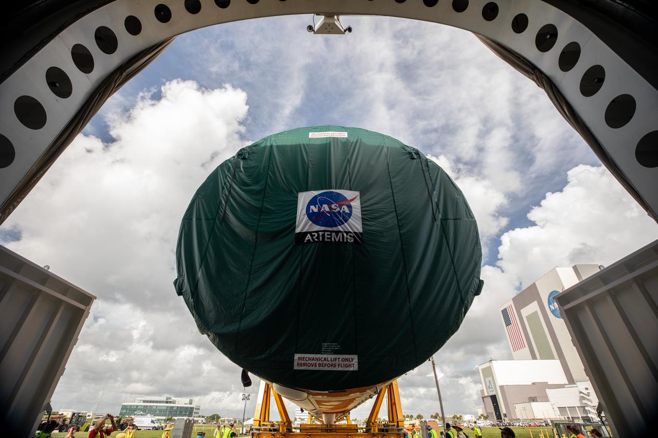 NASA’s massive 212-foot long SLS (Space Launch System) core stage is offloaded from the agency’s Pegasus Barge on Wednesday, July 24, 2024, after arriving at NASA’s Kennedy Space Center in Florida. Teams with Exploration Ground Systems (EGS) will transfer the rocket stage to the spaceport’s Vehicle Assembly Building to prepare it for integration atop the mobile launcher ahead of the Artemis II launch.
