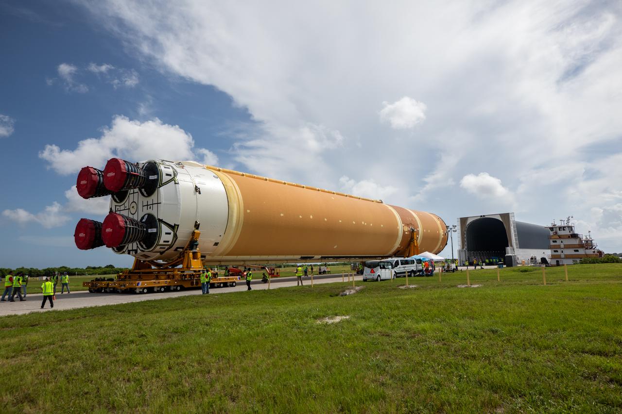 After completing its journey from NASA’s Michoud Assembly Facility in New Orleans aboard the Pegasus barge, teams with Exploration Ground Systems (EGS) transport the agency’s powerful SLS (Space Launch System) core stage to NASA’s Kennedy Space Center’s Vehicle Assembly Building in Florida on Wednesday, July 24, 2024. Once inside, SLS will be prepared for integration atop the mobile launcher ahead of the Artemis II launch. 
