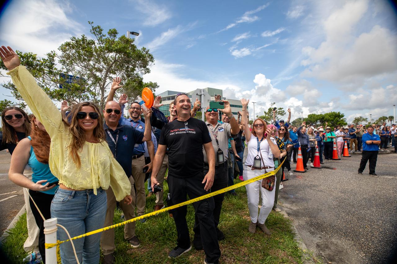 Employees from NASA’s Kennedy Space Center in Florida watch as teams with Exploration Ground Systems (EGS) transport the agency’s powerful SLS (Space Launch System) core stage to the spaceport’s Vehicle Assembly Building on Wednesday, July 24, 2024. The 212-foot-long rocket stage completed its journey from NASA’s Michoud Assembly Facility in New Orleans aboard the Pegasus barge the previous day. Once inside, SLS will be prepared for integration atop the mobile launcher ahead of the Artemis II launch. 