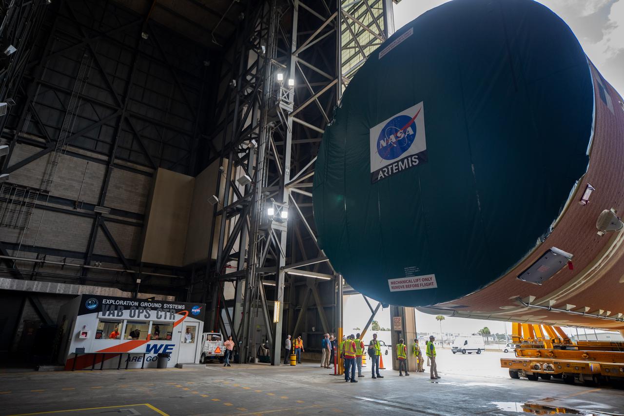 After completing its journey from NASA’s Michoud Assembly Facility in New Orleans aboard the Pegasus barge, teams with Exploration Ground Systems (EGS) transport the agency’s powerful SLS (Space Launch System) core stage into the transfer aisle inside the Vehicle Assembly Building at NASA’s Kennedy Space Center in Florida on Wednesday, July 24, 2024. In the coming months, SLS will be prepared for integration atop the mobile launcher ahead of the Artemis II launch. 