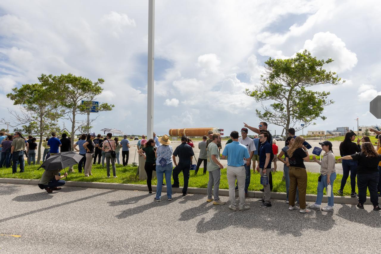 Employees from NASA’s Kennedy Space Center in Florida watch as teams with Exploration Ground Systems (EGS) transport the agency’s powerful SLS (Space Launch System) core stage to the spaceport’s Vehicle Assembly Building on Wednesday, July 24, 2024. The 212-foot-long rocket stage completed its journey from NASA’s Michoud Assembly Facility in New Orleans aboard the Pegasus barge the previous day. Once inside, SLS will be prepared for integration atop the mobile launcher ahead of the Artemis II launch.
