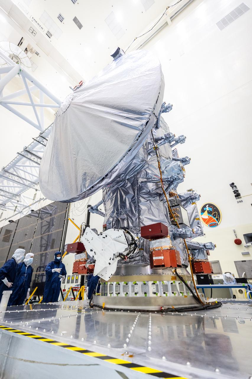 Technicians move NASA’s Europa Clipper spacecraft inside the Payload Hazardous Servicing Facility to accommodate installation of its five-panel solar array at the agency’s Kennedy Space Center in Florida on Thursday, Aug. 1, 2024. After moving the spacecraft, the team had to precisely align the spacecraft in preparation for the installation. The huge arrays – spanning more than 100 feet when fully deployed, or about the length of a basketball court – will collect sunlight to power the spacecraft as it flies multiple times around Jupiter’s icy moon, Europa, conducting science investigations to determine its potential to support life.