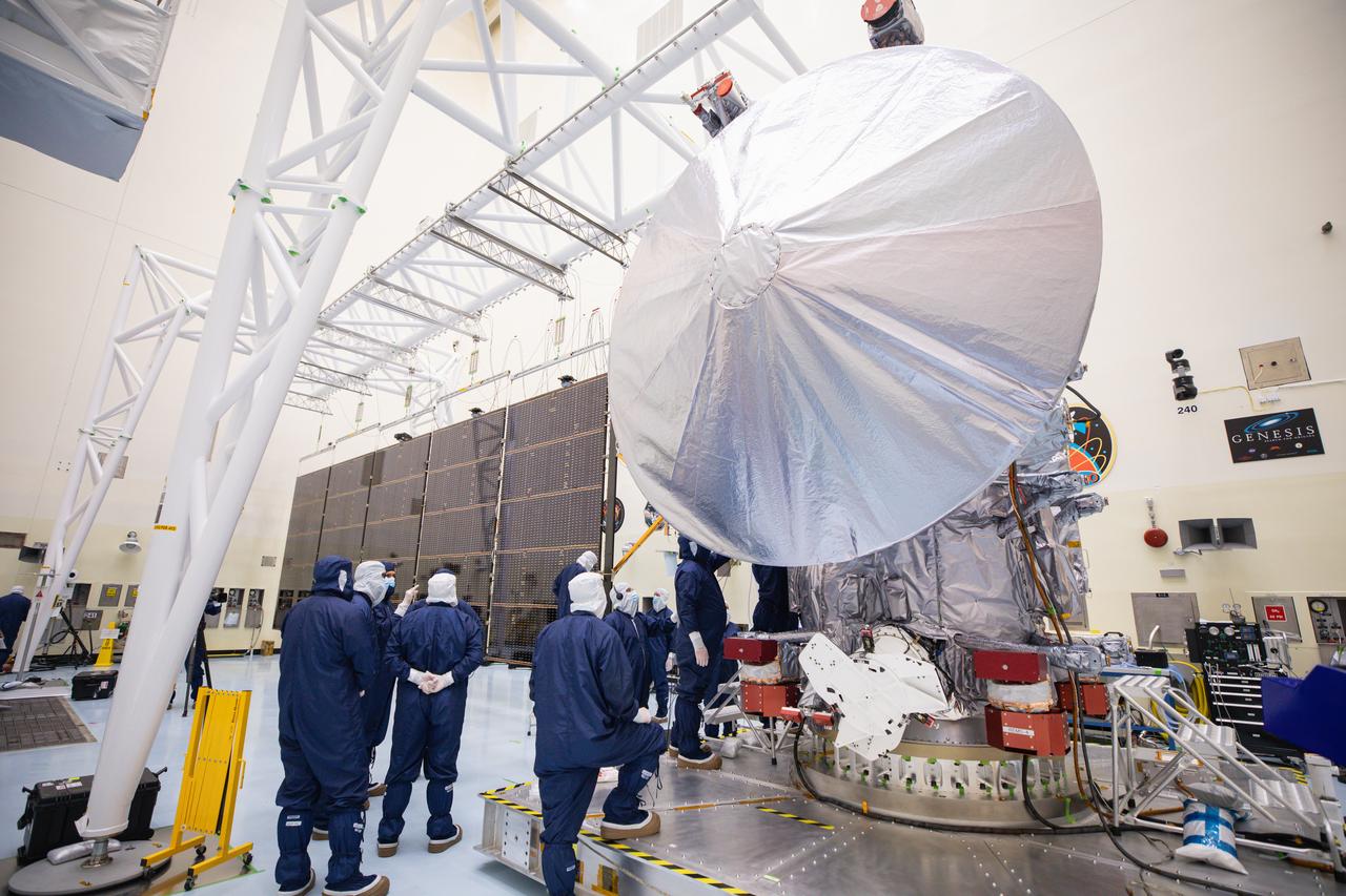 Technicians attach the five-panel solar arrays to NASA’s Europa Clipper spacecraft inside the Payload Hazardous Servicing Facility at the agency’s Kennedy Space Center in Florida on Friday, Aug. 2, 2024. The huge arrays – spanning more than 100 feet when fully deployed, or about the length of a basketball court – will collect sunlight to power the spacecraft as it explores Jupiter’s icy moon, Europa, conducting science investigations to determine its potential to support life.