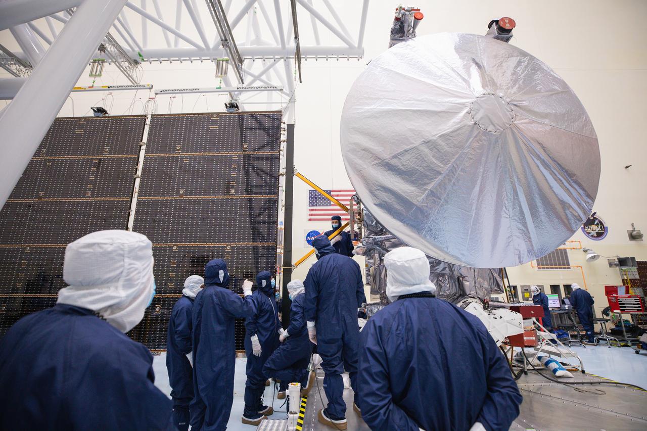 Technicians attach the five-panel solar arrays to NASA’s Europa Clipper spacecraft inside the Payload Hazardous Servicing Facility at the agency’s Kennedy Space Center in Florida on Friday, Aug. 2, 2024. The huge arrays – spanning more than 100 feet when fully deployed, or about the length of a basketball court – will collect sunlight to power the spacecraft as it explores Jupiter’s icy moon, Europa, conducting science investigations to determine its potential to support life.