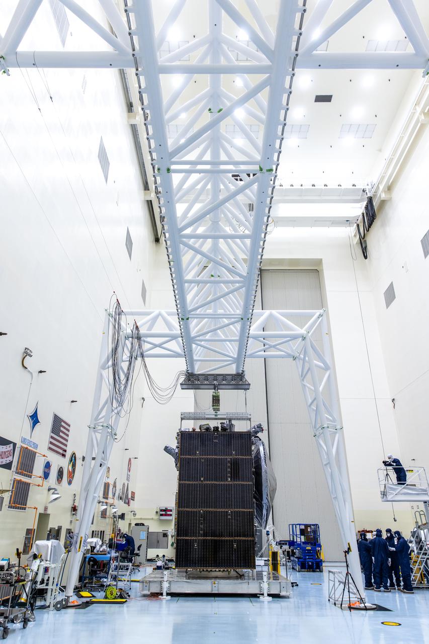 Technicians tested deploying a set of massive solar arrays measuring about 46.5 feet (14.2 meters) long and about 13.5 feet (4.1 meters) high for NASA’s Europa Clipper spacecraft inside the agency’s Payload Hazardous Servicing Facility at Kennedy Space Center in Florida on Wednesday, Aug. 7, 2024. Once launched to study Jupiter’s icy moon, Europa, the solar arrays will fully extend to power the spacecraft to perform  flybys to gather science and data to determine if the moon can support habitable conditions. 