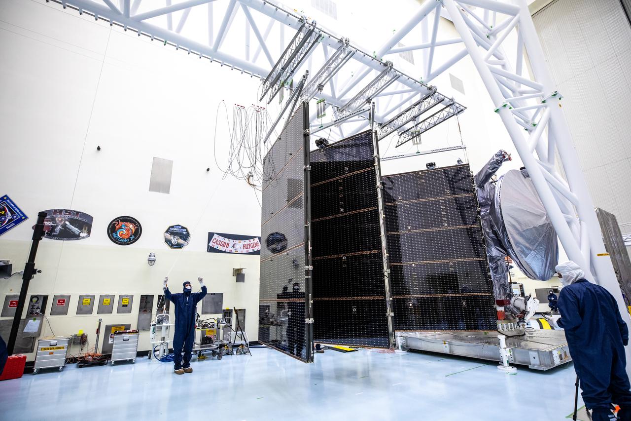 Technicians tested deploying a set of massive solar arrays measuring about 46.5 feet (14.2 meters) long and about 13.5 feet (4.1 meters) high for NASA’s Europa Clipper spacecraft inside the agency’s Payload Hazardous Servicing Facility at Kennedy Space Center in Florida on Wednesday, Aug. 7, 2024. Once launched to study Jupiter’s icy moon, Europa, the solar arrays will fully extend to power the spacecraft to perform  flybys to gather science and data to determine if the moon can support habitable conditions. 