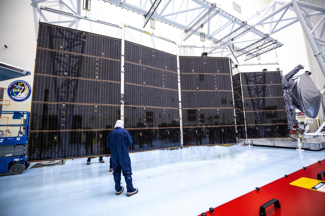 Technicians tested deploying a set of massive solar arrays measuring about 46.5 feet (14.2 meters) long and about 13.5 feet (4.1 meters) high for NASA’s Europa Clipper spacecraft inside the agency’s Payload Hazardous Servicing Facility at Kennedy Space Center in Florida on Wednesday, Aug. 7, 2024. Once launched to study Jupiter’s icy moon, Europa, the solar arrays will fully extend to power the spacecraft to perform  flybys to gather science and data to determine if the moon can support habitable conditions. 