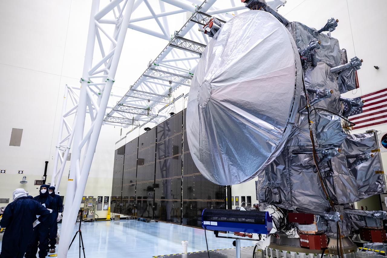 Technicians tested deploying a set of massive solar arrays measuring about 46.5 feet (14.2 meters) long and about 13.5 feet (4.1 meters) high for NASA’s Europa Clipper spacecraft inside the agency’s Payload Hazardous Servicing Facility at Kennedy Space Center in Florida on Wednesday, Aug. 7, 2024. Once launched to study Jupiter’s icy moon, Europa, the solar arrays will fully extend to power the spacecraft to perform  flybys to gather science and data to determine if the moon can support habitable conditions. 