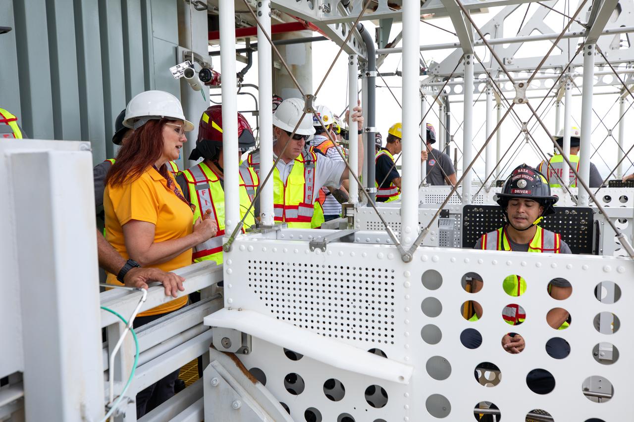 Teams with NASA’s Exploration Ground Systems Program, as well as NASA’s pad rescue team, conduct training inside the Artemis emergency egress baskets at Launch Pad 39B as part of the Artemis emergency egress demonstration training at the agency’s Kennedy Space Center in Florida on Thursday, Aug. 8, 2024. The baskets, similar to gondolas on ski lifts, are used in the case of a pad abort emergency to enable astronauts and other pad personnel a way to quickly escape away from the mobile launcher to the base of the pad and where waiting emergency transport vehicles will then drive them away. 