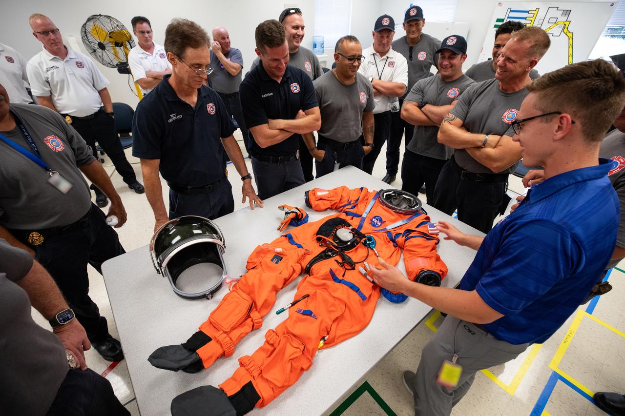NASA’s pad rescue team learn about the Orion Crew Survival Suit ahead of the Artemis II emergency egress demonstration, which is one of the integrated system verification and validation tests taking place at Launch Pad 39B at the agency’s Kennedy Space Center in Florida on Thursday, Aug. 8, 2024. In the event of an emergency during launch countdown, the pad rescue team is there to help personnel leave the launch pad if needed. 