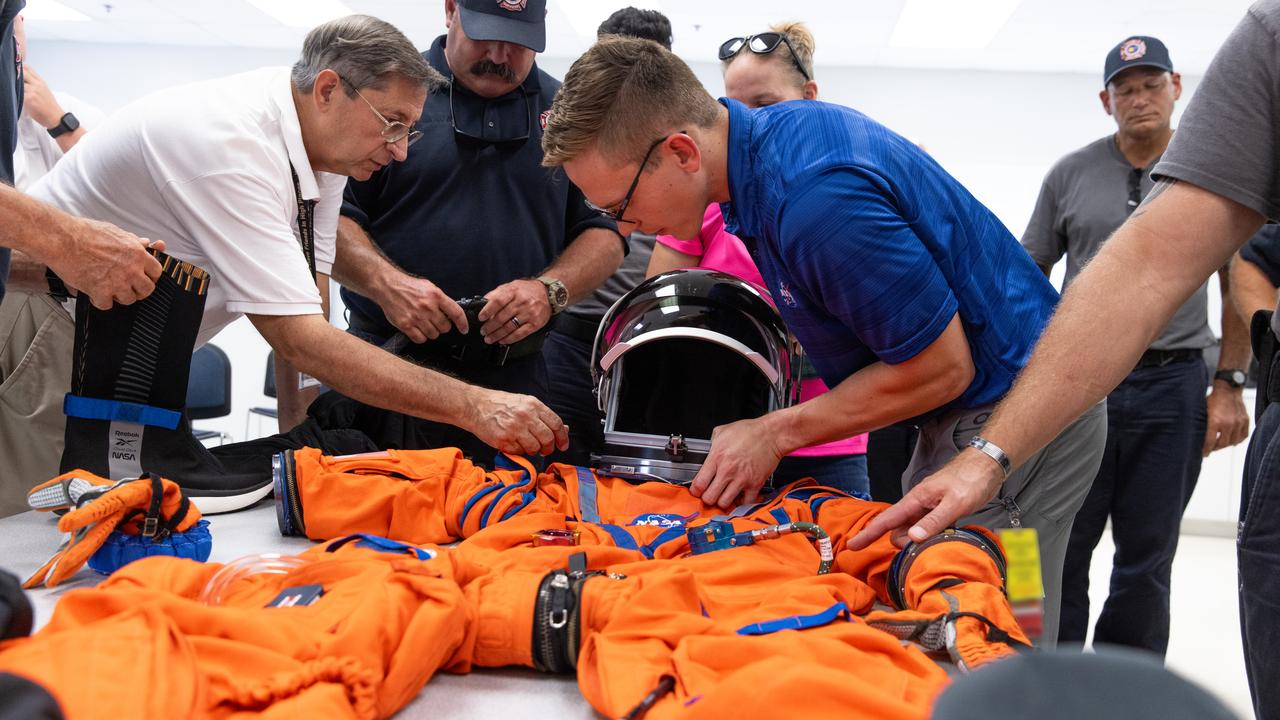 NASA’s pad rescue team learn about the Orion Crew Survival Suit ahead of the Artemis II emergency egress demonstration, which is one of the integrated system verification and validation tests taking place at Launch Pad 39B at the agency’s Kennedy Space Center in Florida on Thursday, Aug. 8, 2024. In the event of an emergency during launch countdown, the pad rescue team is there to help personnel leave the launch pad if needed. 