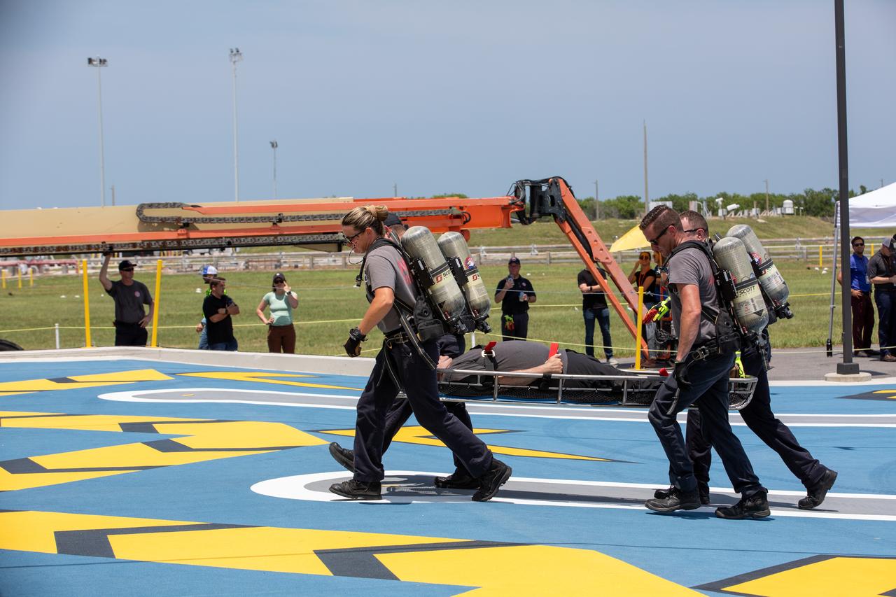 Teams at NASA’s Kennedy Space Center in Florida practice the Artemis mission emergency escape or egress procedures during a series of integrated system verification and validation tests at Launch Complex 39B on Friday, Aug. 9, 2024. Members of the closeout crew, pad rescue team, and the Exploration Ground Systems Program practiced the process of getting in and out of the emergency egress baskets then down to the launch pad where they would be transported to emergency transport vehicles and driven to safety. Prior to this test and throughout the course of several months, teams conducted several basket release demonstrations to validate the system.