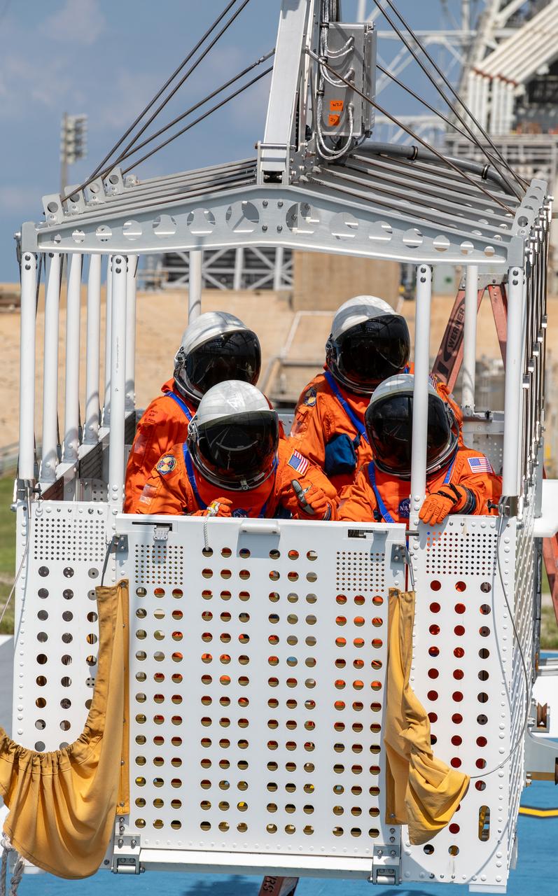 Teams at NASA’s Kennedy Space Center in Florida practice the Artemis mission emergency escape or egress procedures during a series of integrated system verification and validation tests at Launch Complex 39B on Friday, Aug. 9, 2024. Simulated flight crew members practice getting out of the emergency egress basket and into the emergency transport vehicle to drive them to safety in the event of an unlikely emergency during launch countdown.