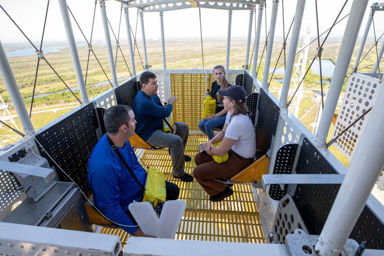 Teams at NASA’s Kennedy Space Center in Florida practice the Artemis mission emergency escape or egress procedures during a series of integrated system verification and validation tests at Launch Pad 39B on Sunday, Aug. 11, 2024. Members of the closeout crew, pad rescue team and the Exploration Ground Systems Program practiced the process of getting inside and out of the emergency egress baskets. While the crew and other personnel will ride the emergency egress baskets to the terminus area in a real emergency, no one rode the baskets for this test. Instead, teams tested the baskets during separate occasions by using water tanks filled to different levels to replicate simulate the weight of passengers. 