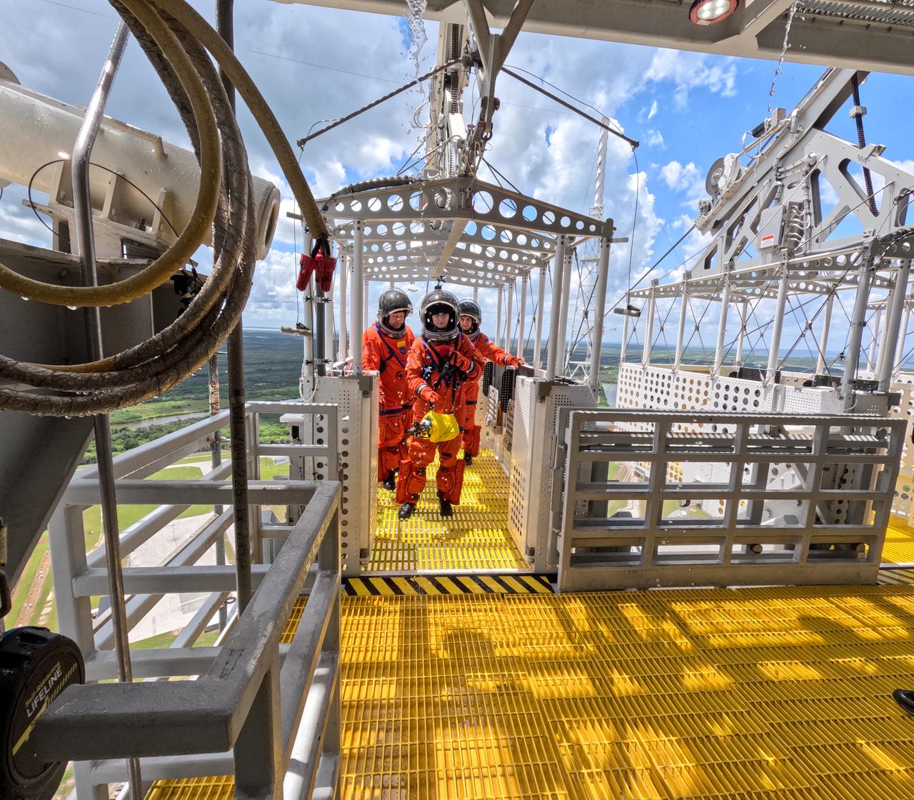 Teams at NASA’s Kennedy Space Center in Florida practice the Artemis mission emergency escape or egress procedures during a series of integrated system verification and validation tests at Launch Pad 39B on Sunday, Aug. 11, 2024. Members of the closeout crew, simulated flight crew, pad rescue team, and the Exploration Ground Systems Program practiced the process of getting inside and out of the emergency egress baskets. While the crew and other personnel will ride the emergency egress baskets to the terminus area in a real emergency, no one rode the baskets for this test. Instead, teams tested the baskets during separate occasions by using water tanks filled to different levels to replicate simulate the weight of passengers. 
