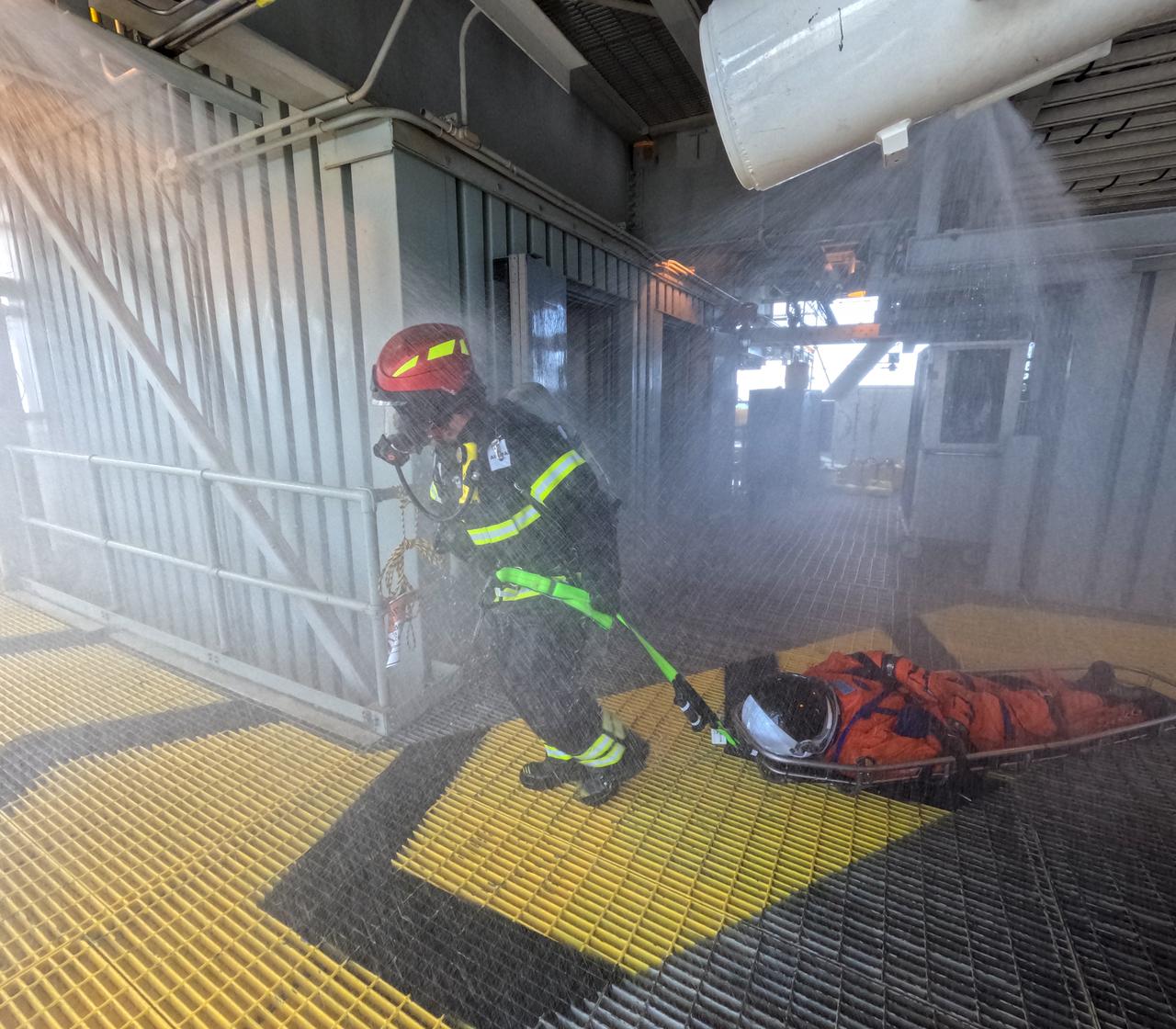 Teams at NASA’s Kennedy Space Center in Florida practice the Artemis mission emergency escape or egress procedures during a series of integrated system verification and validation tests at Launch Pad 39B on Sunday, Aug. 11, 2024. Members of the closeout crew, simulated flight crew, pad rescue team, and the Exploration Ground Systems Program practiced the process of getting inside and out of the emergency egress baskets. While the crew and other personnel will ride the emergency egress baskets to the terminus area in a real emergency, no one rode the baskets for this test. Instead, teams tested the baskets during separate occasions by using water tanks filled to different levels to replicate simulate the weight of passengers. 