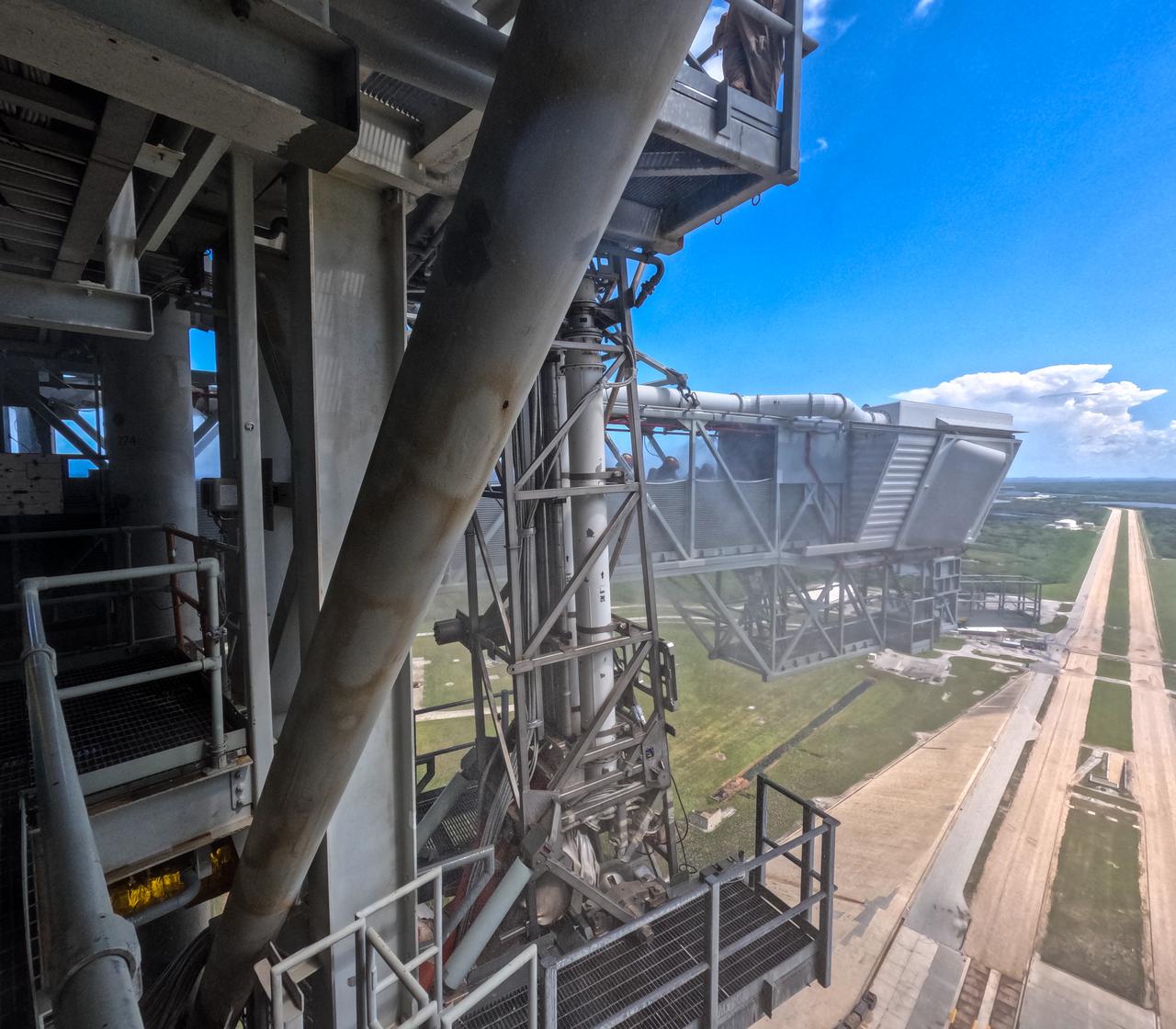 Teams at NASA’s Kennedy Space Center in Florida practice the Artemis mission emergency escape or egress procedures during a series of integrated system verification and validation tests at Launch Pad 39B on Sunday, Aug. 11, 2024. Members of the closeout crew, pad rescue team and the Exploration Ground Systems Program practiced walking to the crew access arm and getting inside and out of the emergency egress baskets. While the crew and other personnel will ride the emergency egress baskets to the terminus area in a real emergency, no one rode the baskets for this test. Instead, teams tested the baskets during separate occasions by using water tanks filled to different levels to replicate simulate the weight of passengers. 