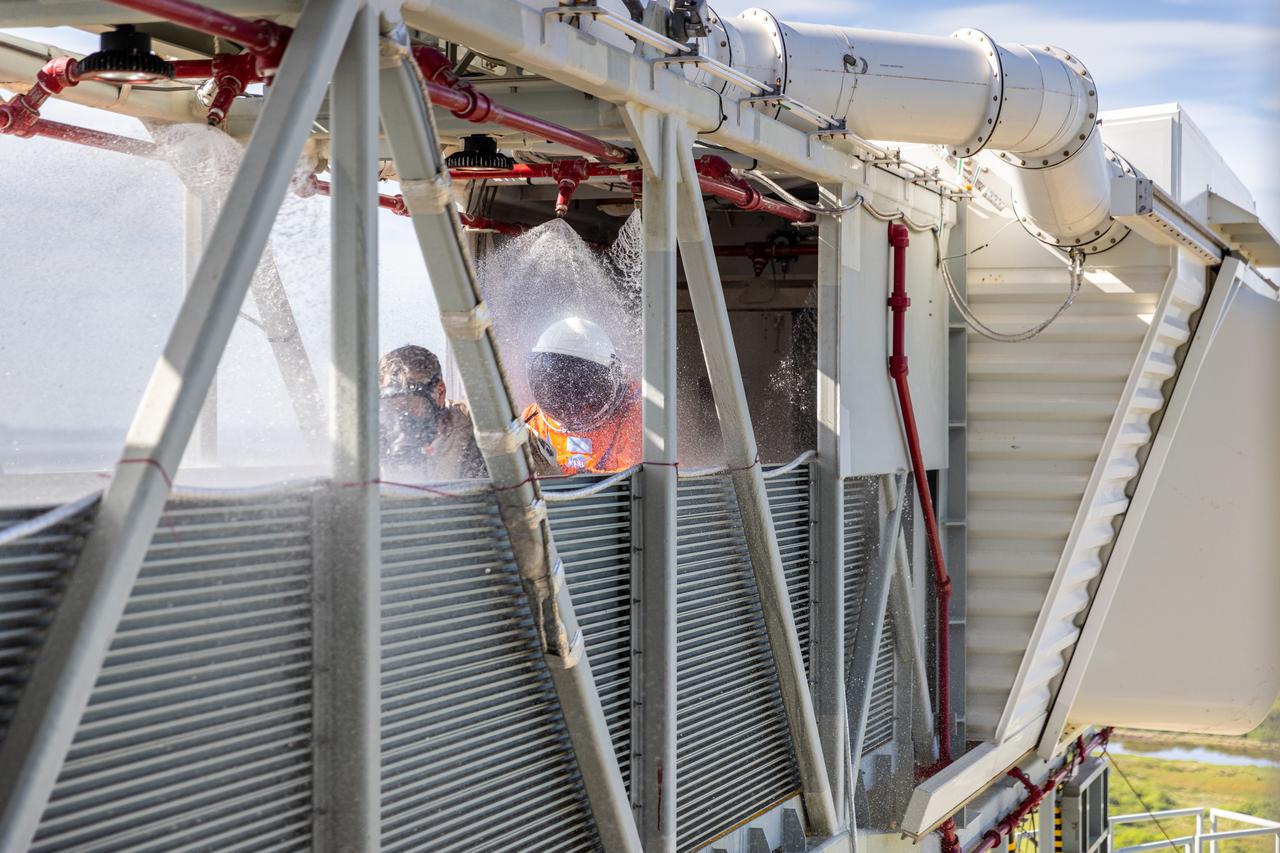 Teams at NASA’s Kennedy Space Center in Florida practice the Artemis mission emergency escape or egress procedures during a series of integrated system verification and validation tests at Launch Pad 39B on Monday, Aug. 12, 2024. Members of the closeout crew, pad rescue team and the Exploration Ground Systems Program practiced the process of getting inside and out of the emergency egress baskets. While the crew and other personnel will ride the emergency egress baskets to the terminus area in a real emergency, no one rode the baskets for this test. Instead, teams tested the baskets during separate occasions by using water tanks filled to different levels to replicate simulate the weight of passengers.