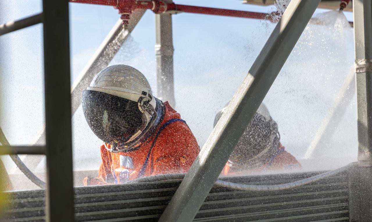 Teams at NASA’s Kennedy Space Center in Florida practice the Artemis mission emergency escape or egress procedures during a series of integrated system verification and validation tests at Launch Pad 39B on Monday, Aug. 12, 2024. Members of the closeout crew, pad rescue team and the Exploration Ground Systems Program practiced the process of getting inside and out of the emergency egress baskets. While the crew and other personnel will ride the emergency egress baskets to the terminus area in a real emergency, no one rode the baskets for this test. Instead, teams tested the baskets during separate occasions by using water tanks filled to different levels to replicate simulate the weight of passengers.