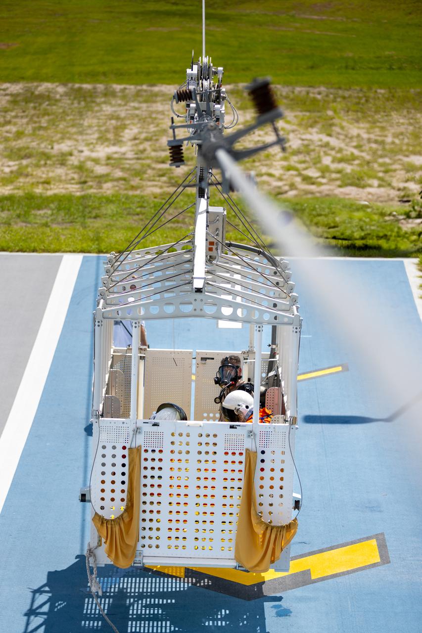 Teams at NASA’s Kennedy Space Center in Florida practice the Artemis mission emergency escape or egress procedures during a series of integrated system verification and validation tests at Launch Pad 39B on Monday, Aug. 12, 2024. Members of the closeout crew, pad rescue team and the Exploration Ground Systems Program practiced the process of getting inside and out of the emergency egress baskets. While the crew and other personnel will ride the emergency egress baskets to the terminus area in a real emergency, no one rode the baskets for this test. Instead, teams tested the baskets during separate occasions by using water tanks filled to different levels to replicate simulate the weight of passengers.