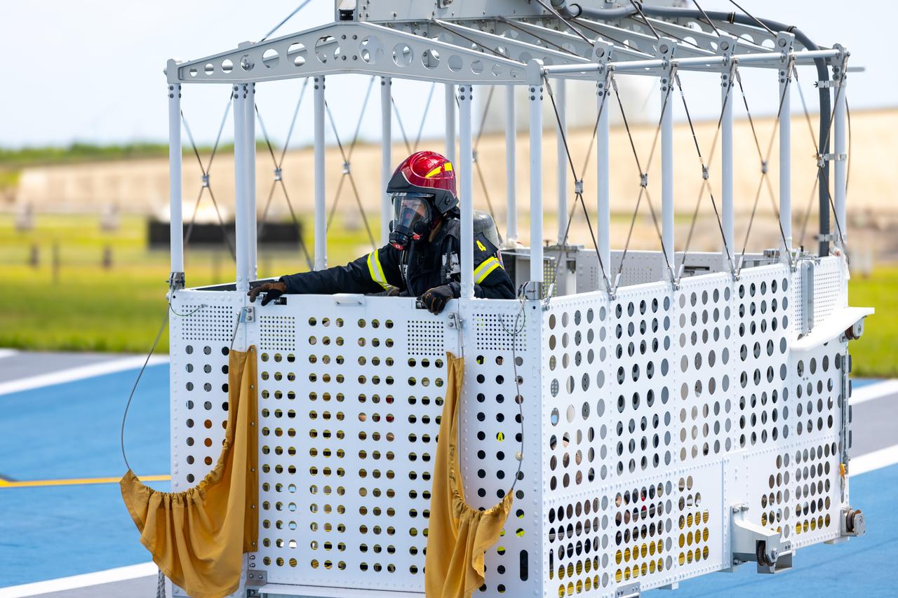 Teams at NASA’s Kennedy Space Center in Florida practice the Artemis mission emergency escape or egress procedures during a series of integrated system verification and validation tests at Launch Pad 39B on Monday, Aug. 12, 2024. Members of the closeout crew, pad rescue team and the Exploration Ground Systems Program practiced the process of getting inside and out of the emergency egress baskets. While the crew and other personnel will ride the emergency egress baskets to the terminus area in a real emergency, no one rode the baskets for this test. Instead, teams tested the baskets during separate occasions by using water tanks filled to different levels to replicate simulate the weight of passengers.