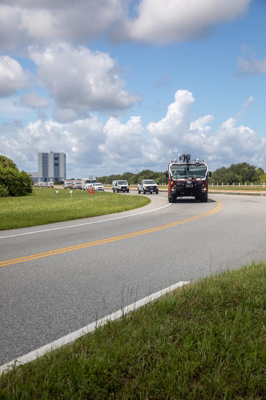 Medical and fire-rescue personnel participate in the Artemis II mission emergency escape or egress verification and validation tests near Launch Complex 39 at NASA's Kennedy Space Center in Florida on Monday, Aug. 12, 2024. During the multi-day tests, members of the closeout crew, pad rescue team, and the Exploration Ground Systems Program practiced the process of getting in and out of the emergency egress baskets then down to the launch pad where they would be transported to emergency transport vehicles and driven to safety. Prior to this test and throughout the course of several months, teams conducted basket release demonstrations to validate the system.
