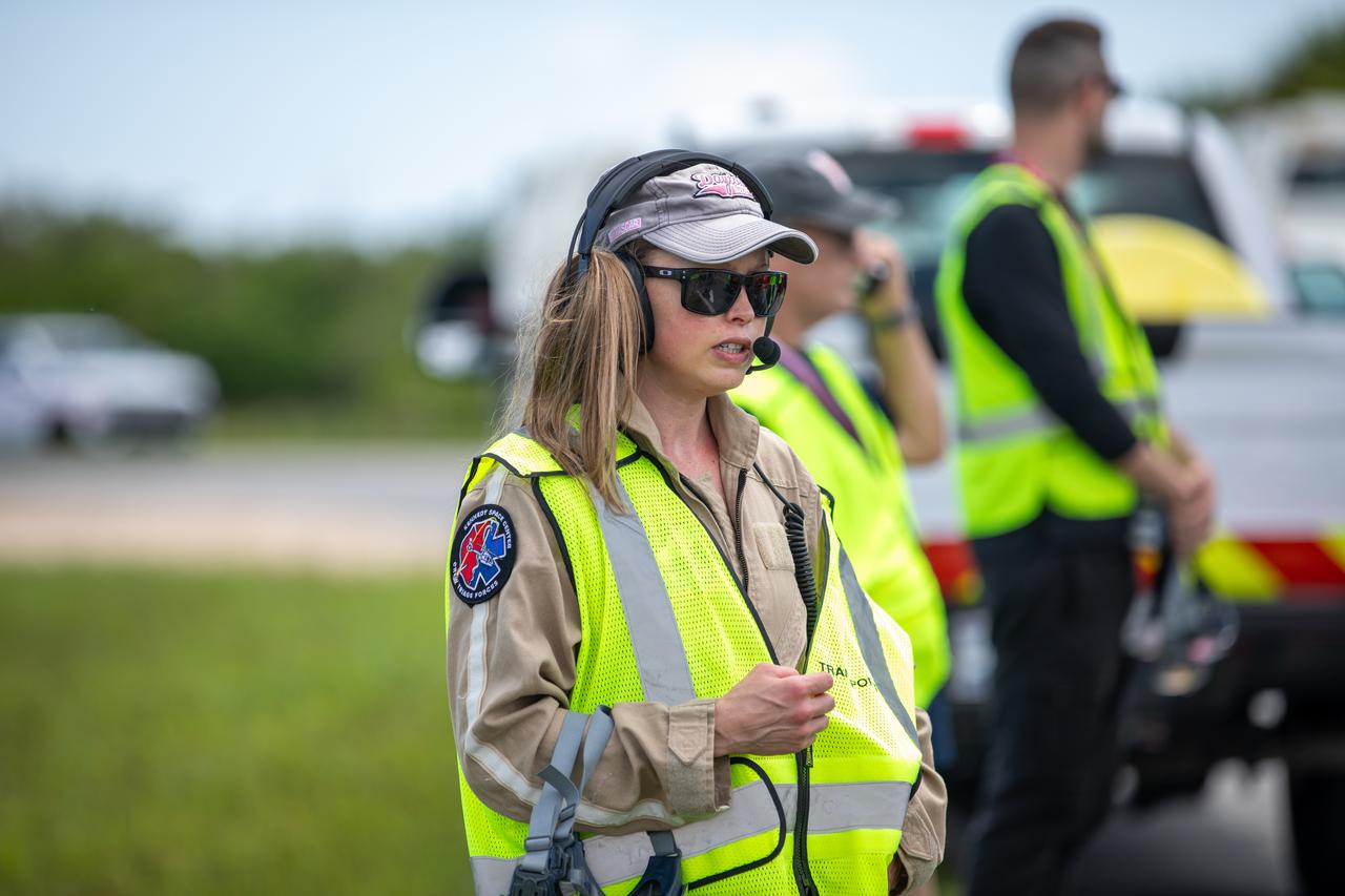Medical and fire-rescue personnel participate in the Artemis II mission emergency escape or egress verification and validation tests near Launch Complex 39 at NASA's Kennedy Space Center in Florida on Monday, Aug. 12, 2024. During the multi-day tests, members of the closeout crew, pad rescue team, and the Exploration Ground Systems Program practiced the process of getting in and out of the emergency egress baskets then down to the launch pad where they would be transported to emergency transport vehicles and driven to safety. Prior to this test and throughout the course of several months, teams conducted basket release demonstrations to validate the system.