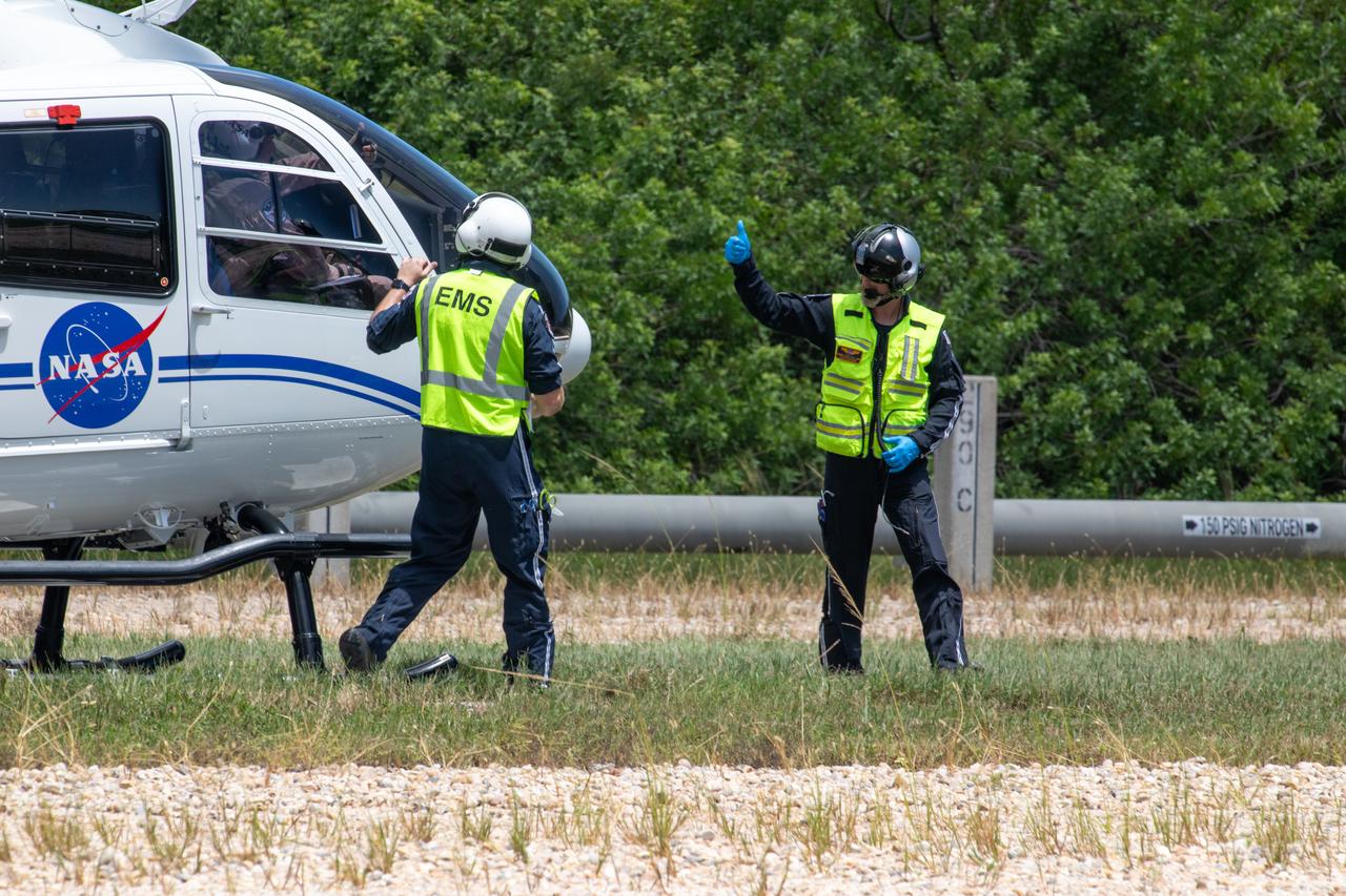 Medical and fire-rescue personnel participate in the Artemis II mission emergency escape or egress verification and validation tests near Launch Complex 39 at NASA's Kennedy Space Center in Florida on Monday, Aug. 12, 2024. During the multi-day tests, members of the closeout crew, pad rescue team, and the Exploration Ground Systems Program practiced the process of getting in and out of the emergency egress baskets then down to the launch pad where they would be transported to emergency transport vehicles and driven to safety. Prior to this test and throughout the course of several months, teams conducted basket release demonstrations to validate the system.
