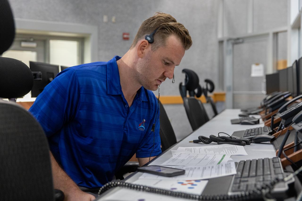 Joseph Pavicic, operations project engineer, Exploration Ground Systems at NASA’s Kennedy Space Center in Florida, participates in an emergency escape or egress demonstration simulation for the Artemis II mission inside Firing Room 1 in the Launch Control Center at NASA’s Kennedy on Monday, Aug. 12, 2024. Other members of the closeout crew, pad rescue team, and the Exploration Ground Systems Program performed emergency egress demonstrations during a series of integrated system verification tests at Launch Pad 39B in preparation for the Artemis II launch.
