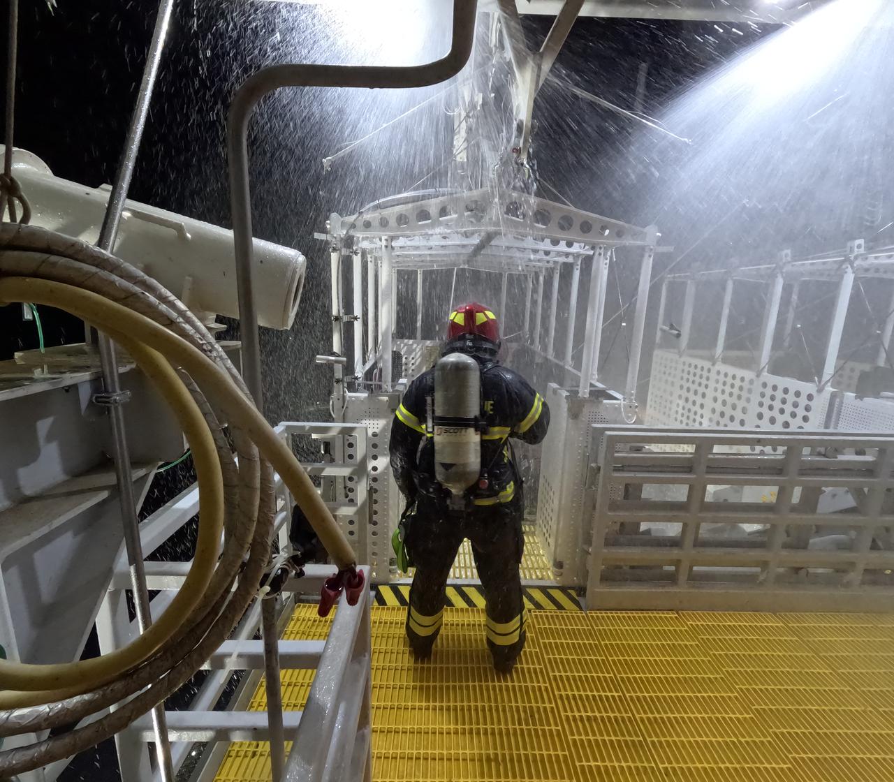 Teams at NASA’s Kennedy Space Center in Florida practice the Artemis mission emergency escape or egress procedures during a series of integrated system verification and validation tests at Launch Pad 39B on Tuesday, Aug. 13, 2024. Members of the closeout crew, pad rescue team, and the Exploration Ground Systems Program – who also suited up as astronauts – practiced the process of getting inside and out of the emergency egress baskets. While the crew and other personnel will ride the emergency egress baskets to the terminus area in a real emergency, no one rode the baskets for this test. Instead, teams tested the baskets during separate occasions by using water tanks filled to different levels to replicate simulate the weight of passengers.