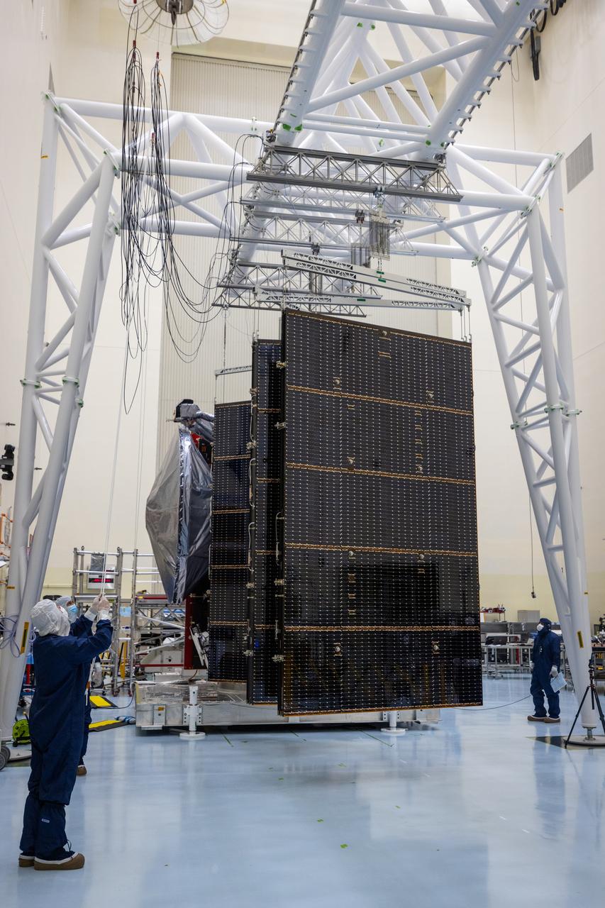 Technicians test the system to deploy NASA’s Europa Clipper spacecraft solar arrays, which uses “thermal knives” to cut the restraints holding the solar arrays in place inside the agency’s Payload Hazardous Servicing Facility at Kennedy Space Center in Florida on Wednesday, Aug. 21, 2024. The Europa Clipper spacecraft will travel to Jupiter’s icy moon to determine its potential to support life. After launch the thermal knives will cut the restraints, allowing the solar arrays to deploy and collect sunlight to power the spacecraft as it begins its journey to investigate Europa.
