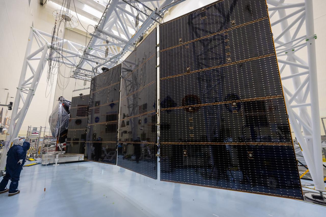Technicians test the system to deploy NASA’s Europa Clipper spacecraft solar arrays, which uses “thermal knives” to cut the restraints holding the solar arrays in place inside the agency’s Payload Hazardous Servicing Facility at Kennedy Space Center in Florida on Wednesday, Aug. 21, 2024. The Europa Clipper spacecraft will travel to Jupiter’s icy moon to determine its potential to support life. After launch the thermal knives will cut the restraints, allowing the solar arrays to deploy and collect sunlight to power the spacecraft as it begins its journey to investigate Europa.