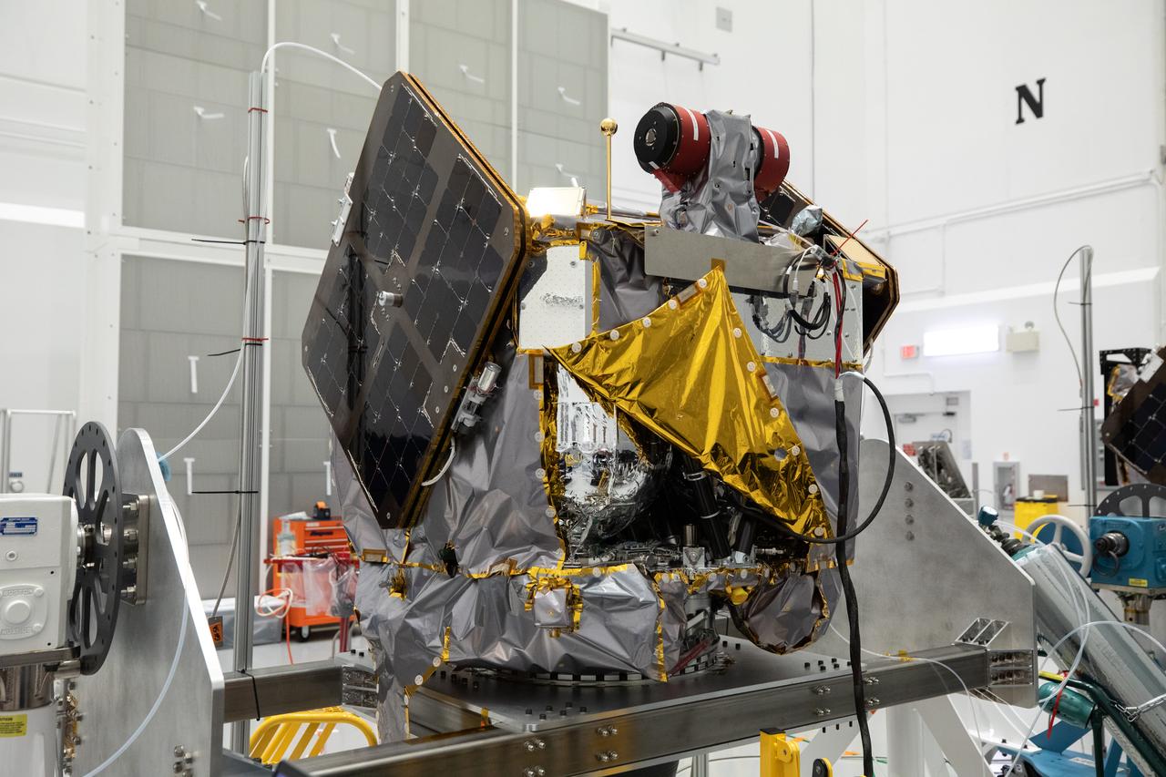 NASA’s ESCAPADE (Escape and Plasma Acceleration and Dynamics Explorers) identical dual spacecraft are inspected and processed on dollies in a high bay of the Astrotech Space Operations Facility near the agency’s Kennedy Space Center in Florida on Thursday, Aug. 22, 2024. As the first multi-spacecraft orbital science mission to Mars, ESCAPADE’s twin orbiters will take simultaneous observations from different locations around the planet and reveal the real-time response to space weather and how the Martian magnetosphere changes over time.
