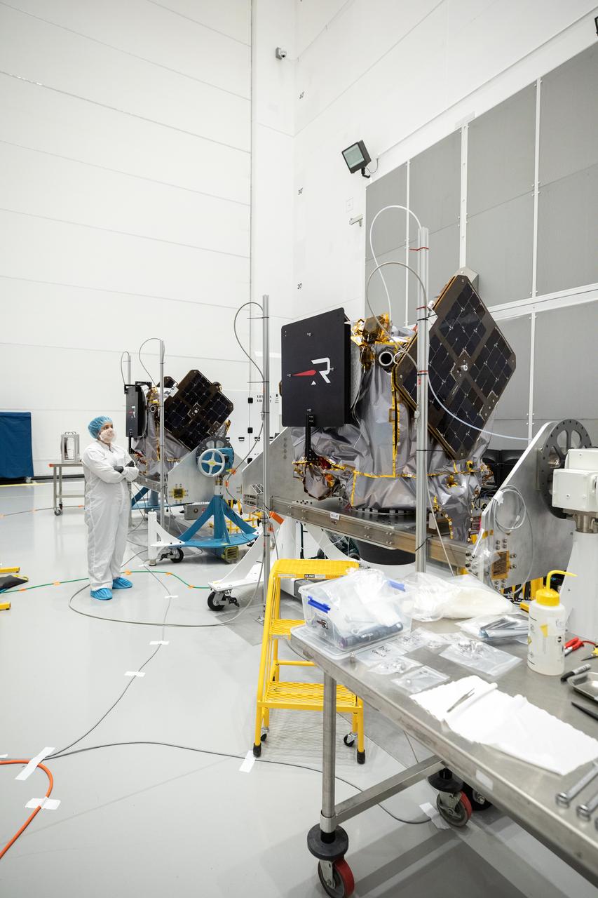 NASA’s ESCAPADE (Escape and Plasma Acceleration and Dynamics Explorers) identical dual spacecraft are inspected and processed on dollies in a high bay of the Astrotech Space Operations Facility near the agency’s Kennedy Space Center in Florida on Thursday, Aug. 22, 2024. As the first multi-spacecraft orbital science mission to Mars, ESCAPADE’s twin orbiters will take simultaneous observations from different locations around the planet and reveal the real-time response to space weather and how the Martian magnetosphere changes over time.