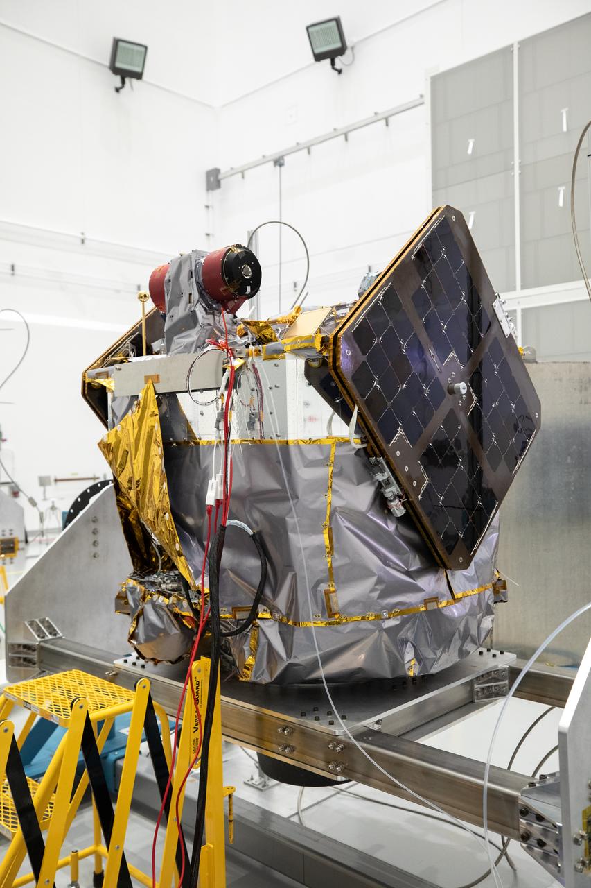 NASA’s ESCAPADE (Escape and Plasma Acceleration and Dynamics Explorers) identical dual spacecraft are inspected and processed on dollies in a high bay of the Astrotech Space Operations Facility near the agency’s Kennedy Space Center in Florida on Thursday, Aug. 22, 2024. As the first multi-spacecraft orbital science mission to Mars, ESCAPADE’s twin orbiters will take simultaneous observations from different locations around the planet and reveal the real-time response to space weather and how the Martian magnetosphere changes over time.