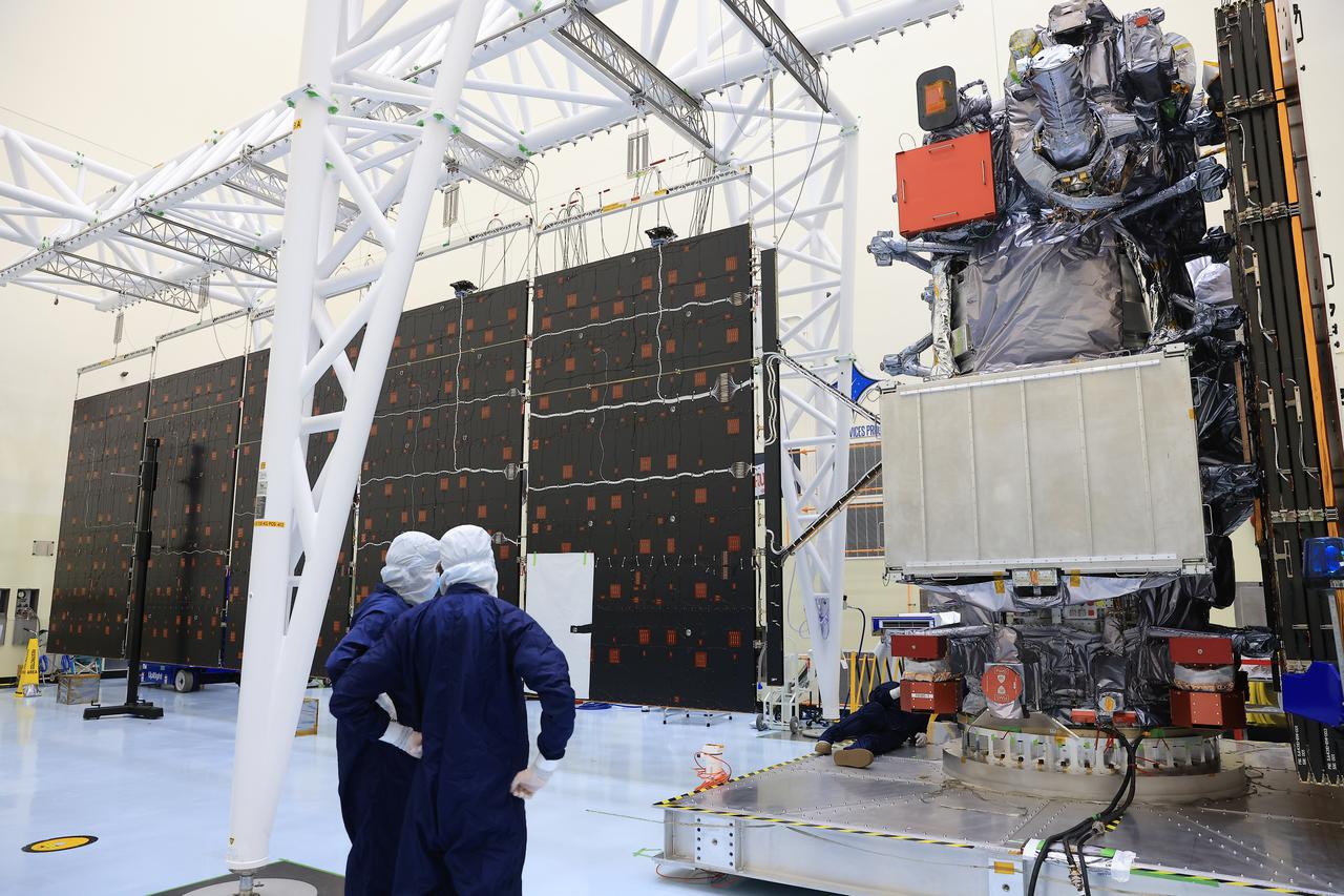 Technicians test and extend one of the two “wings” comprising the solar arrays for NASA’s Europa Clipper spacecraft on Friday, Aug. 23, 2024, at the Payload Hazardous Servicing Facility at the agency’s Kennedy Space Center in Florida. Each array measures about 46.5 feet (14.2 meters) long and about 13.5 feet (4.1 meters) high. The spacecraft needs the massive solar arrays to power to Jupiter’s icy moon Europa to help scientists better understand the astrobiological potential for habitable worlds beyond our planet.
