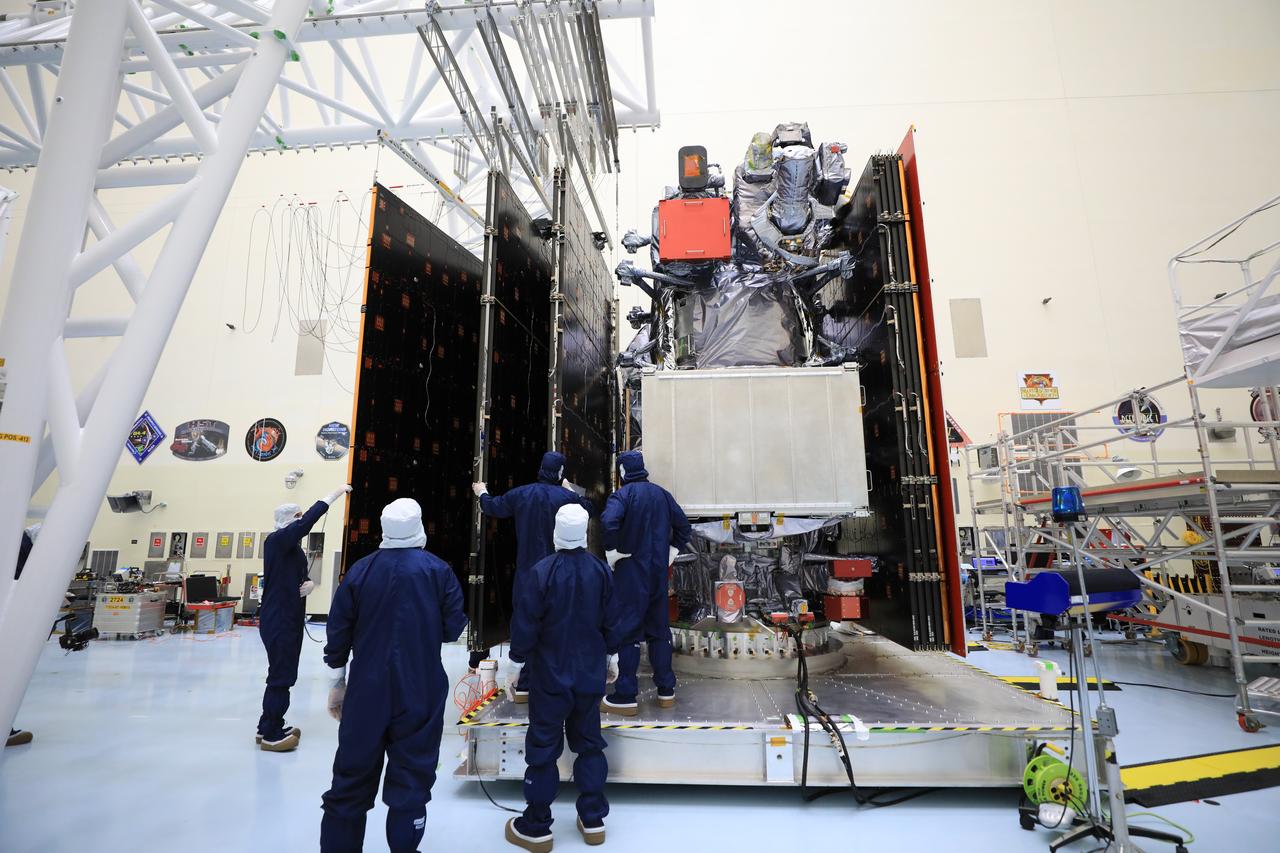 Technicians test, retract, and stow one of the two “wings” comprising the solar arrays for NASA’s Europa Clipper spacecraft on Friday, Aug. 23, 2024, at the Payload Hazardous Servicing Facility at the agency’s Kennedy Space Center in Florida. Each array measures about 46.5 feet (14.2 meters) long and about 13.5 feet (4.1 meters) high when extended. The spacecraft needs the massive solar arrays to power to Jupiter’s icy moon Europa to help scientists better understand the astrobiological potential for habitable worlds beyond our planet.