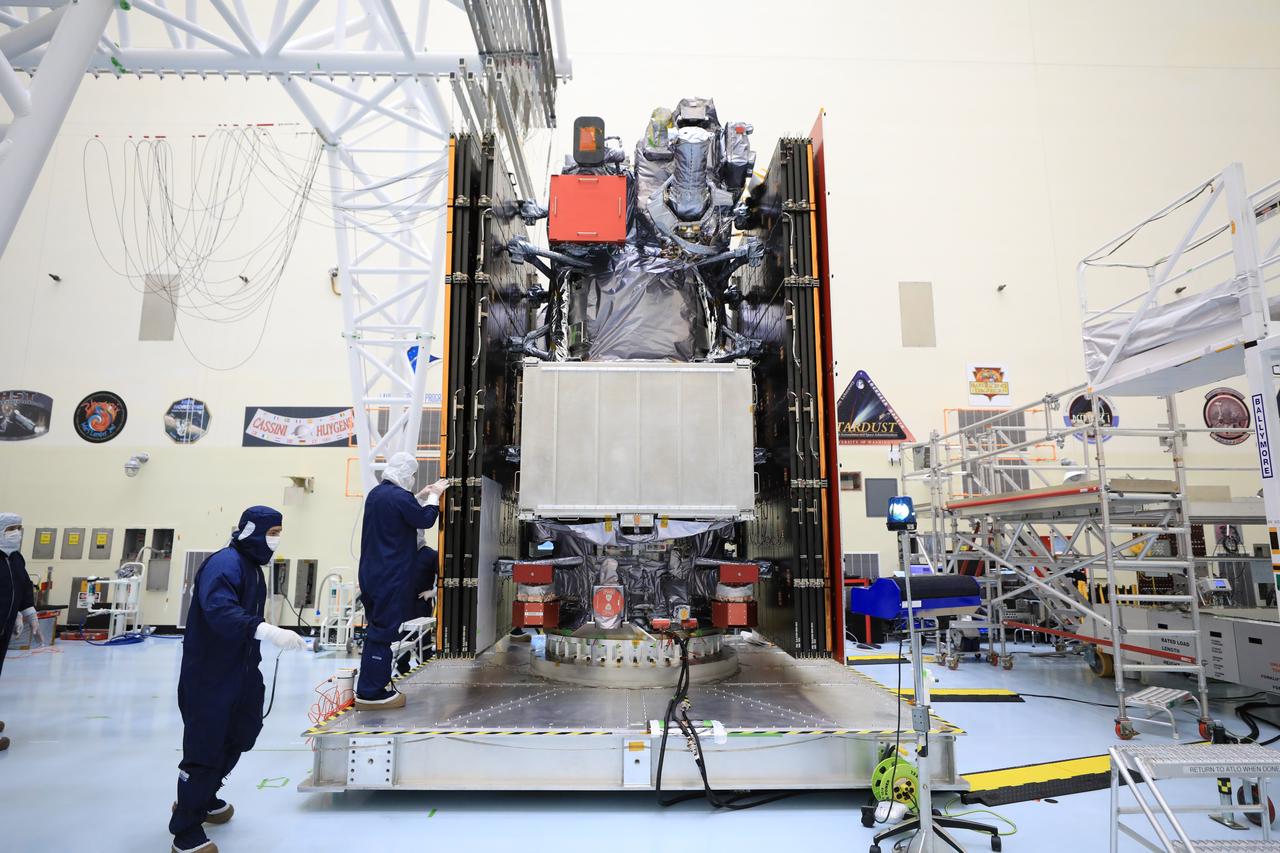 Technicians test, retract, and stow one of the two “wings” comprising the solar arrays for NASA’s Europa Clipper spacecraft on Friday, Aug. 23, 2024, at the Payload Hazardous Servicing Facility at the agency’s Kennedy Space Center in Florida. Each array measures about 46.5 feet (14.2 meters) long and about 13.5 feet (4.1 meters) high when extended. The spacecraft needs the massive solar arrays to power to Jupiter’s icy moon Europa to help scientists better understand the astrobiological potential for habitable worlds beyond our planet.