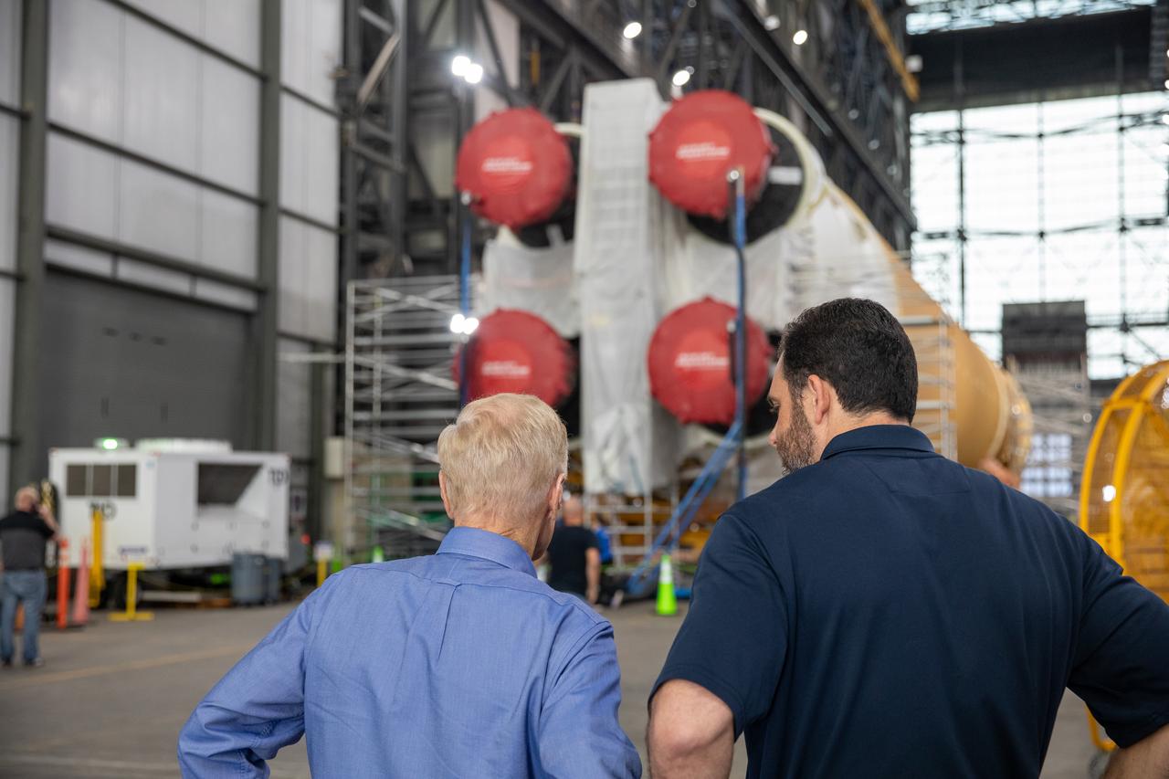 NASA Administrator Bill Nelson and NASA Exploration Ground Systems Program Deputy Manager Jeremy Parsons visit the agency’s SLS (Space Launch System) rocket core stage for the Artemis II mission inside NASA’s Kennedy Space Center in Florida on Thursday, Aug. 29, 2024. In the coming months, teams will integrate the rocket core stage atop the mobile launcher with the additional Artemis II flight hardware, including the twin solid rocket boosters, launch vehicle stage adapter, and the Orion spacecraft.